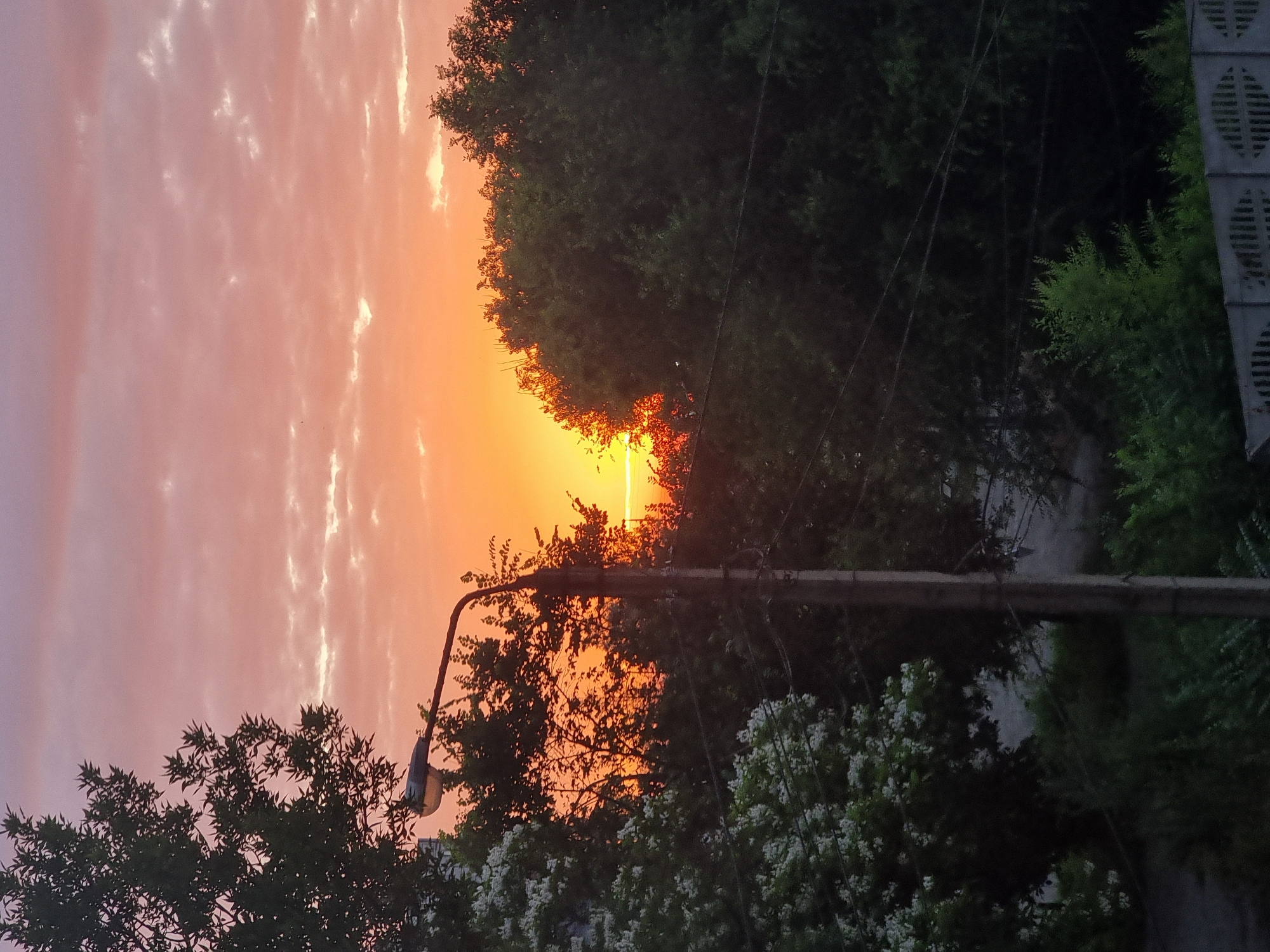 Sunset colors fill the sky over Kryvyi Rih residential area