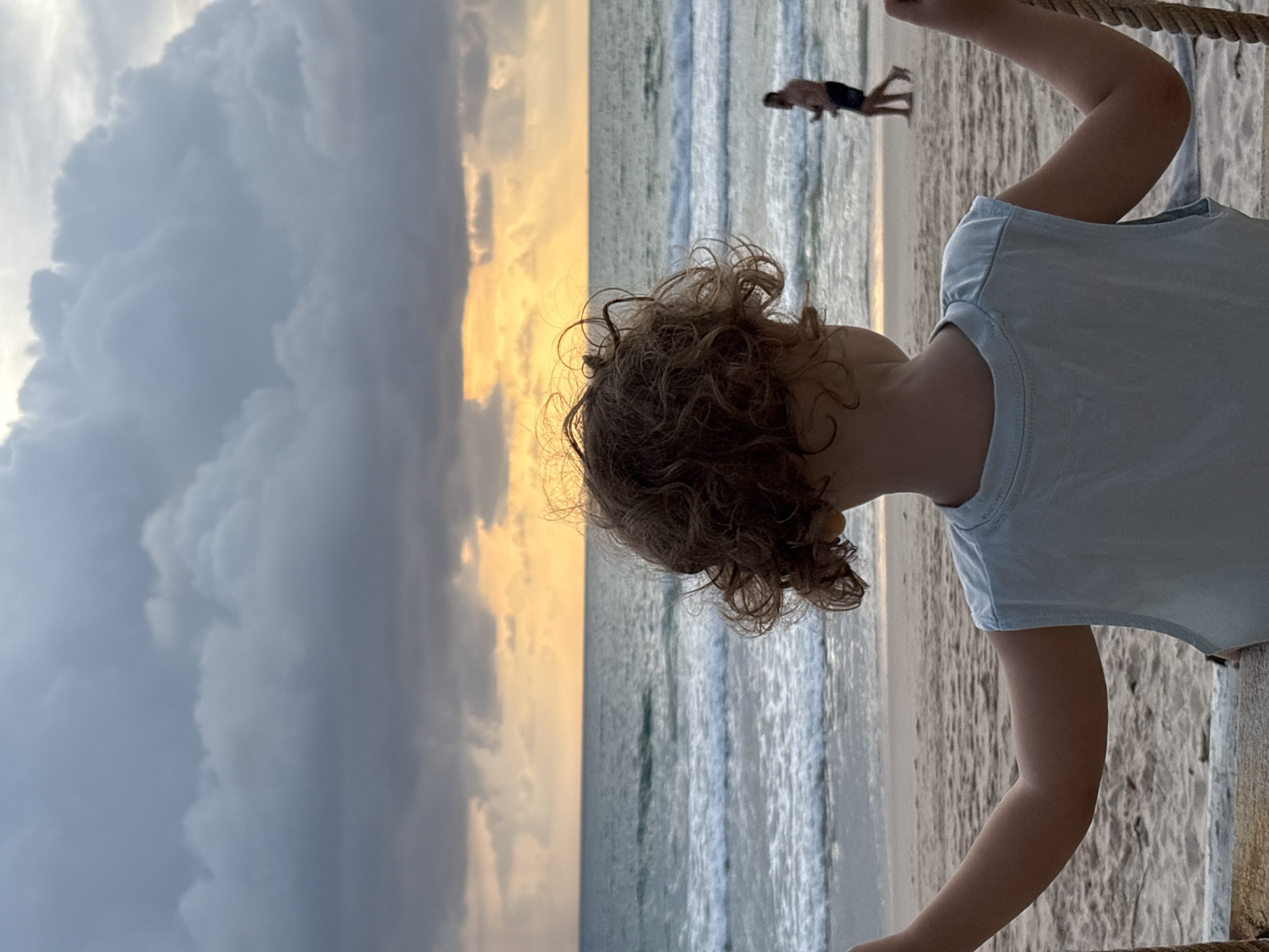 Sunset beach afternoon in Choeng Thale with swing, kite, and stormy skies