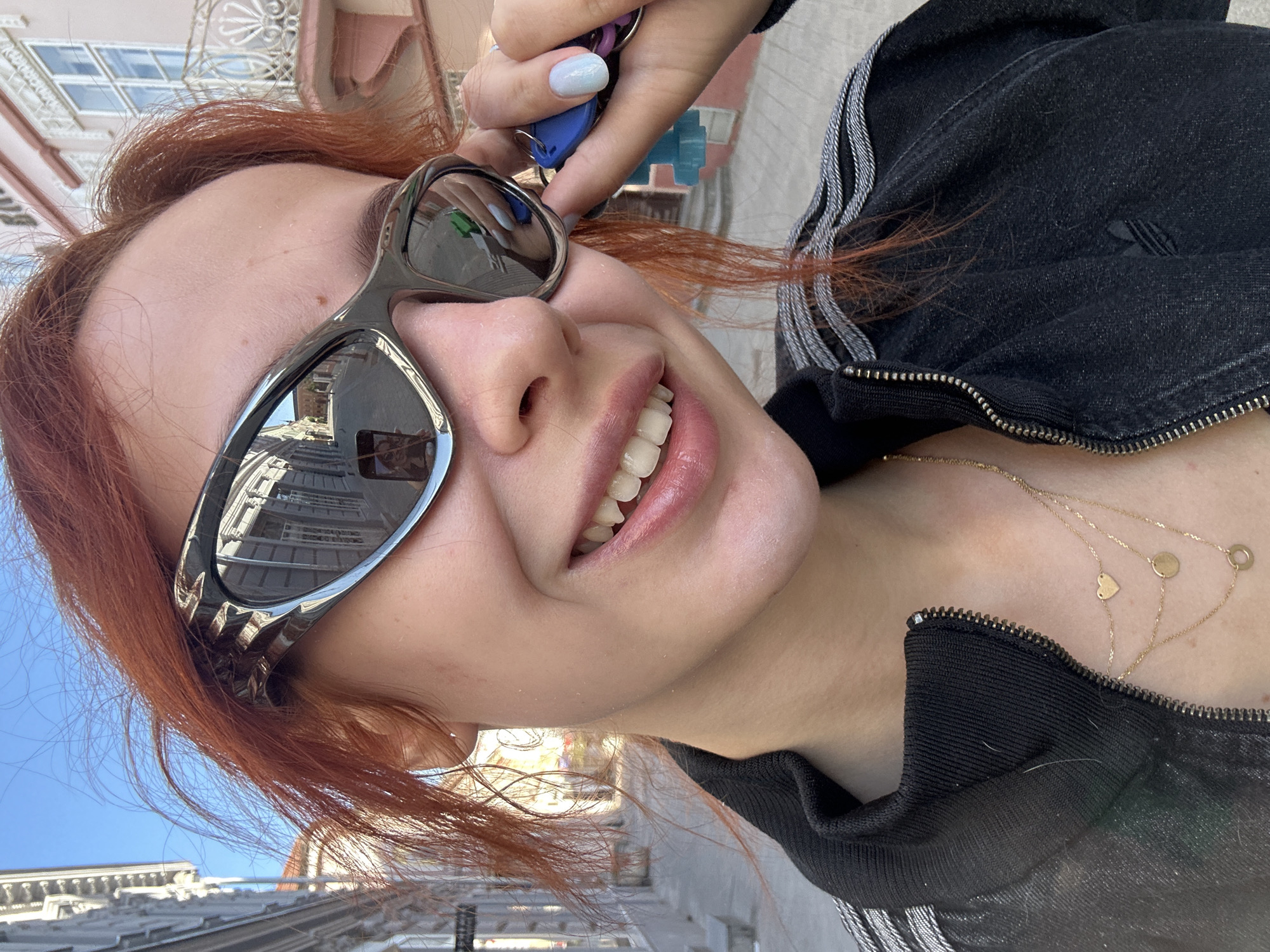 Woman photographed taking selfies in Novi Sad elevator, street
