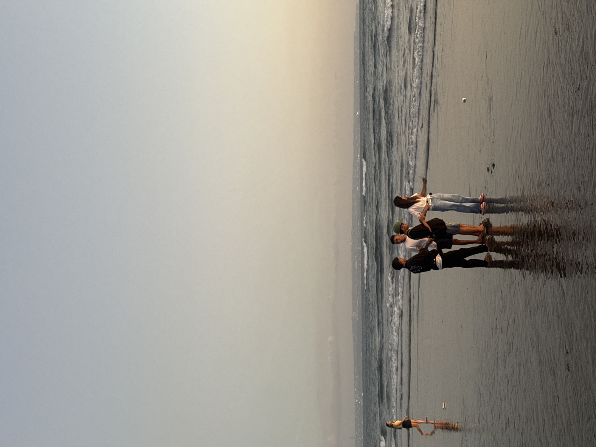 Sunset crowd gathers along North Kuta's shoreline
