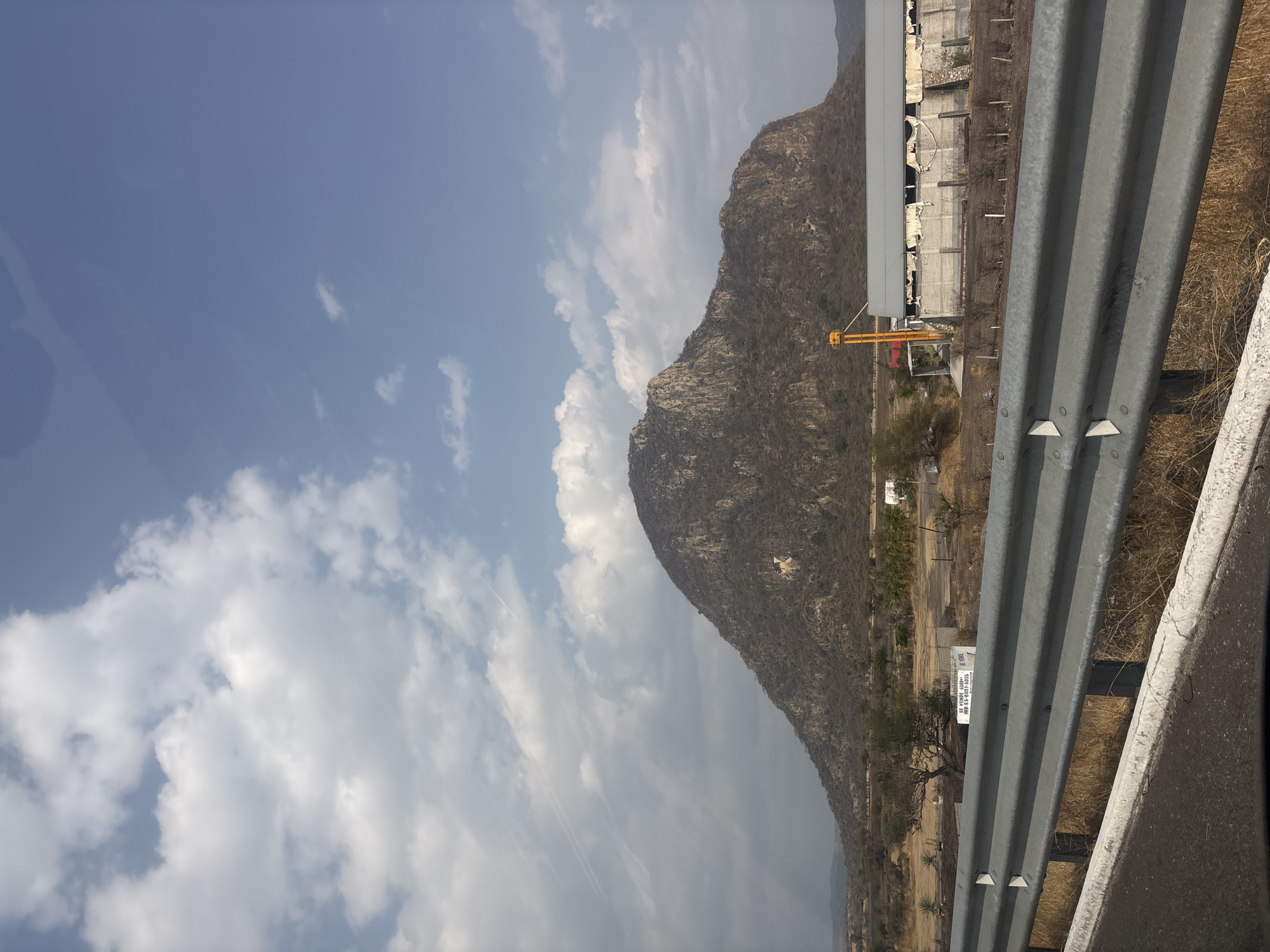 Highway traveler documents mountain landscapes near Jantetelco, Mexico