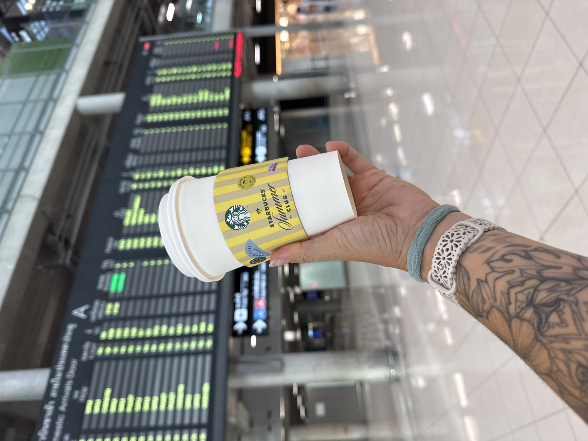 Late-night airport hours at Suvarnabhumi, coffee in hand