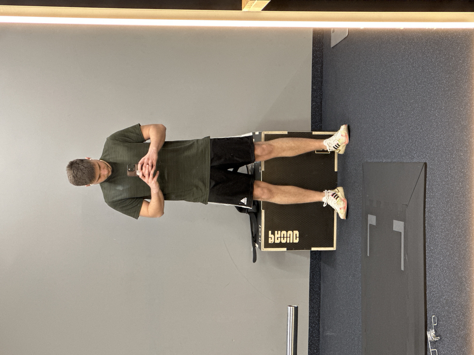 Man checks phone on gym platform in Burgas
