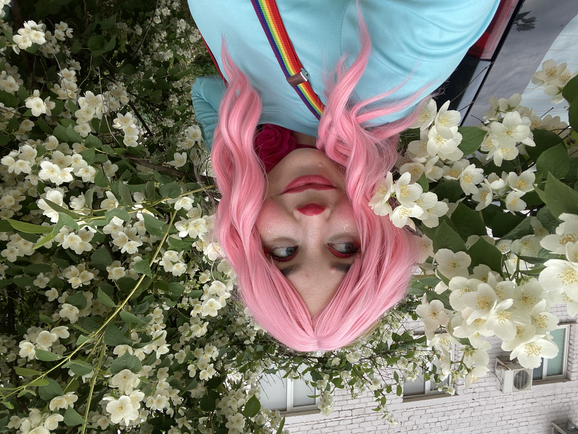 Clown makeup selfies beside jasmine flowers in Chaikovsky