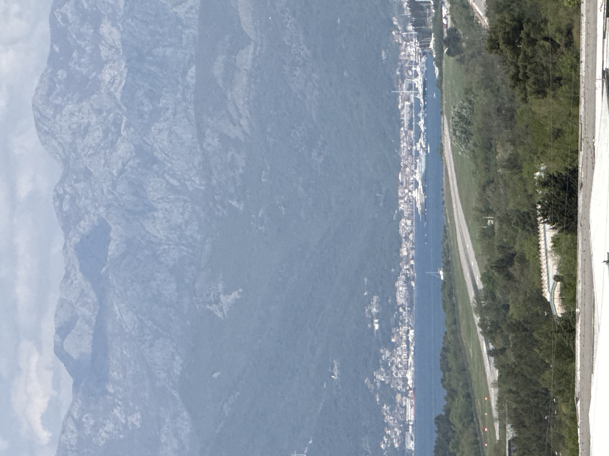 Aerial view captures coastal Sutvara, Montenegro with boats and mountains