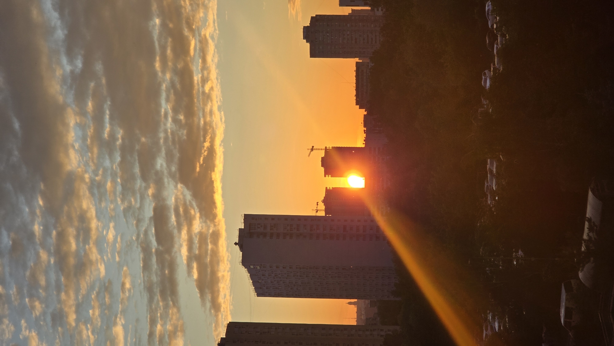 Urban waterfront documented from sunset to nighttime illumination