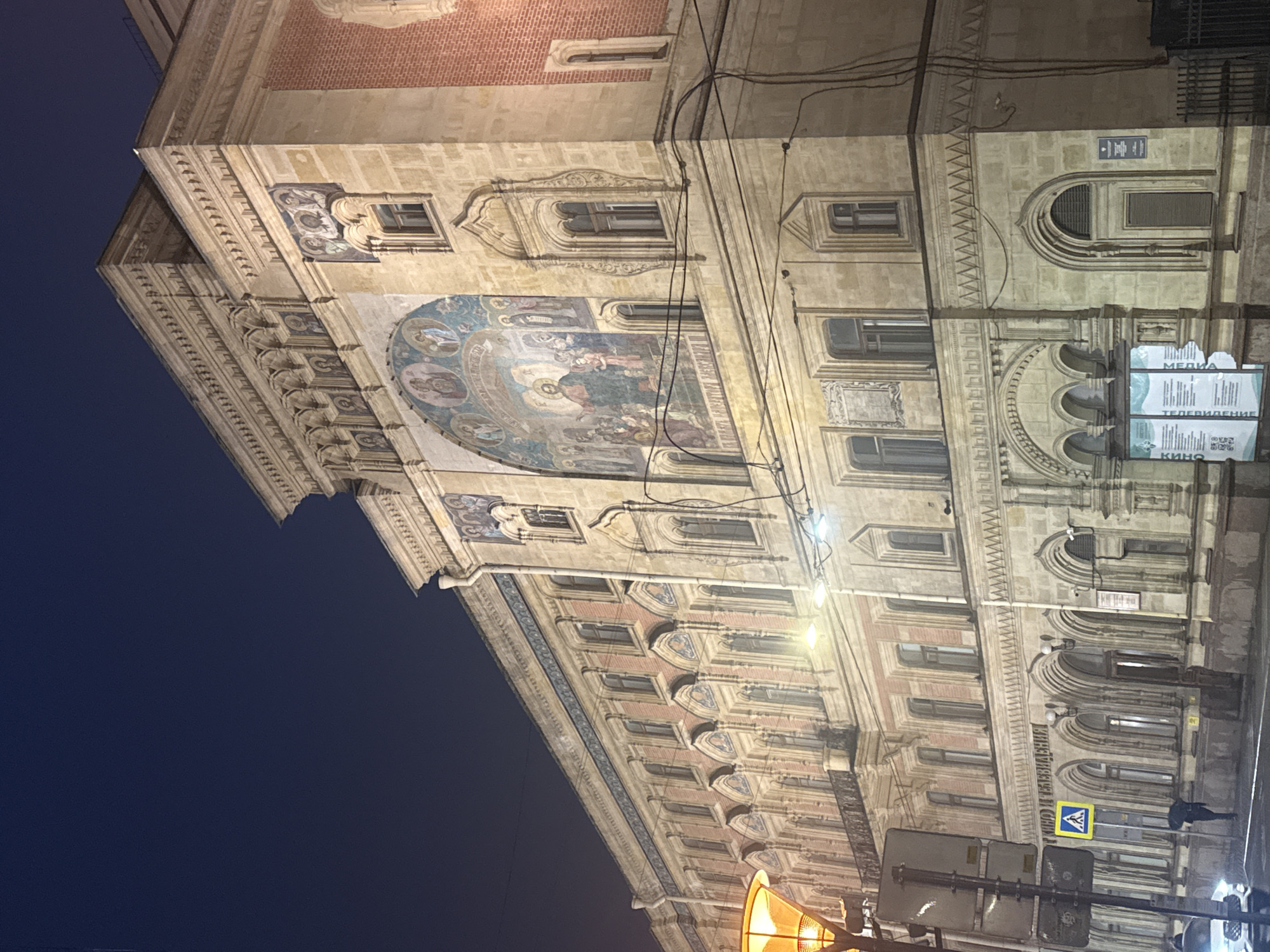 Nighttime architectural tour documented across rainy Saint Petersburg