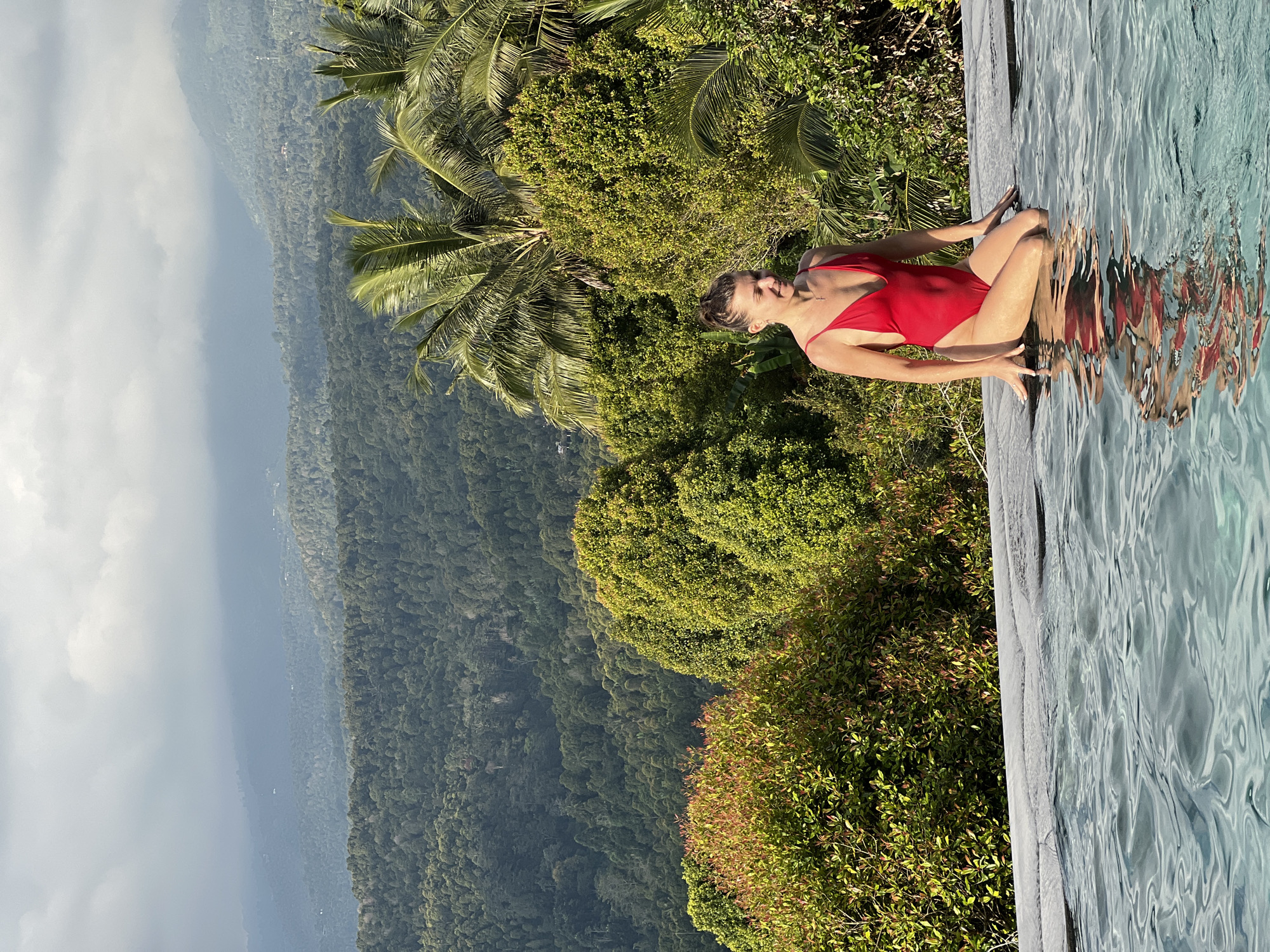 Morning pool party at Busungbiu resort overlooking Indonesian mountains