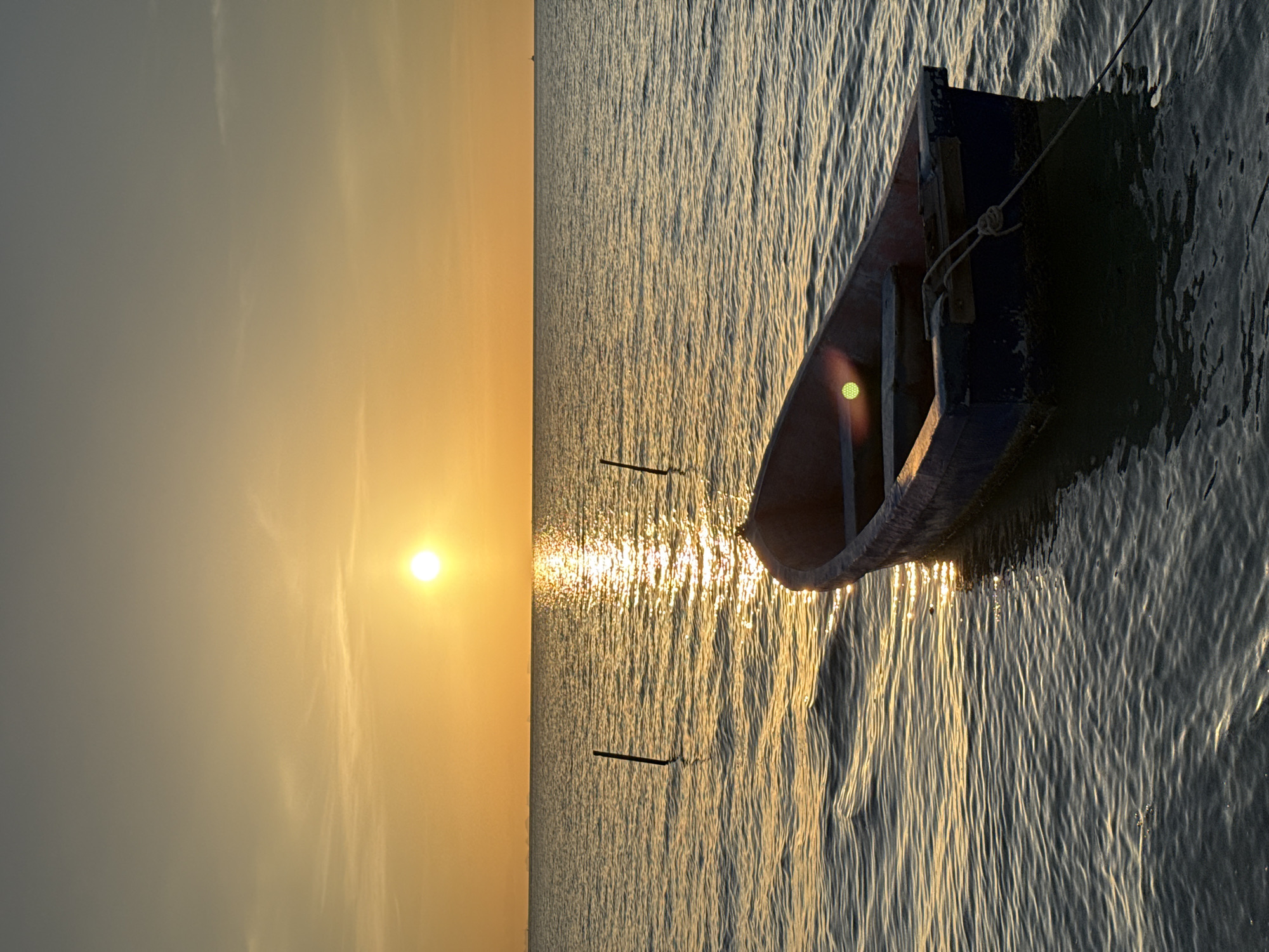 Tethered rowboat at sunset, Ko Samui waters