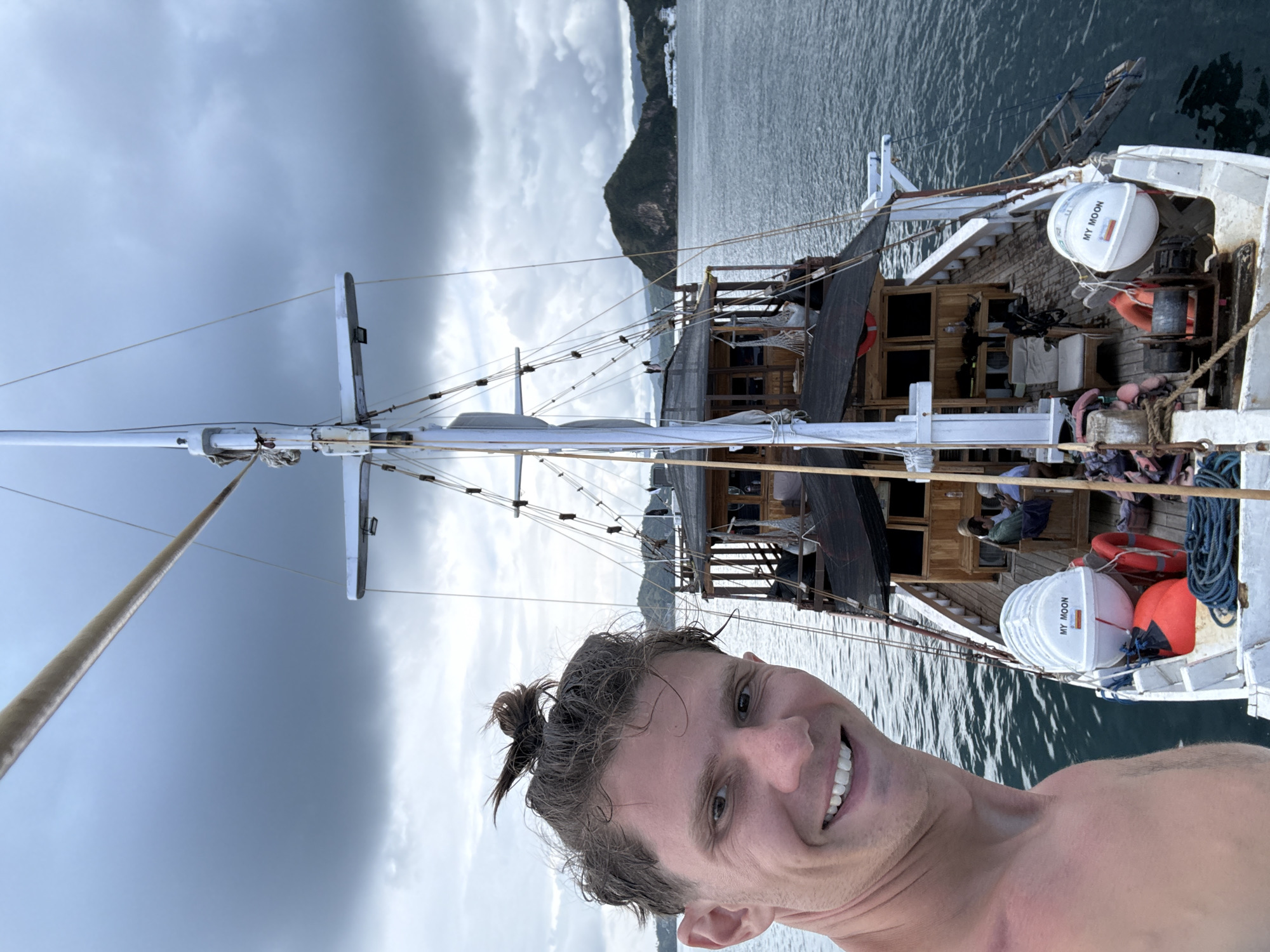 Man takes boat selfies near Pasir Putih, Indonesia