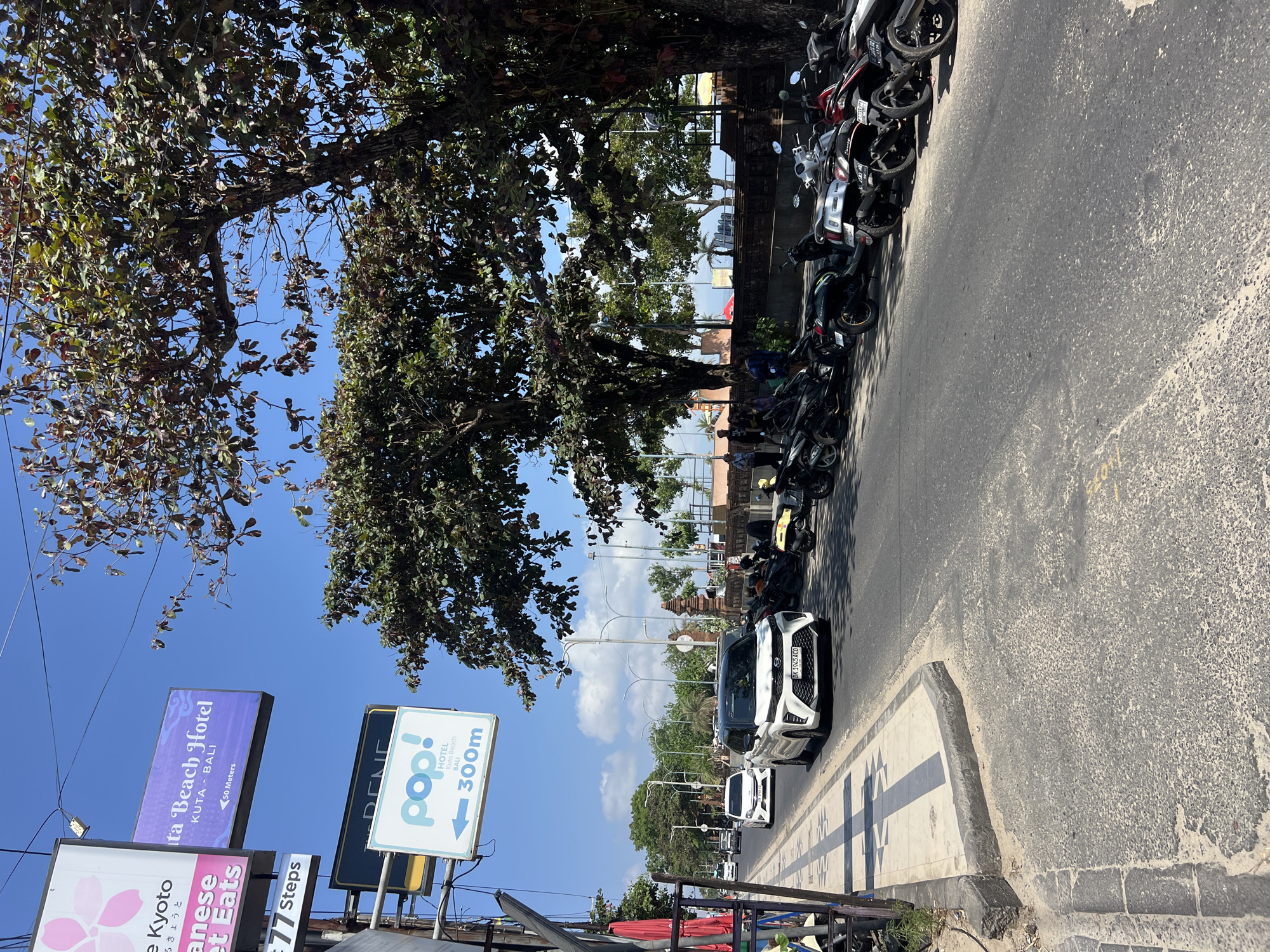 Kuta beach town morning: shoreline, markets, and street scenes
