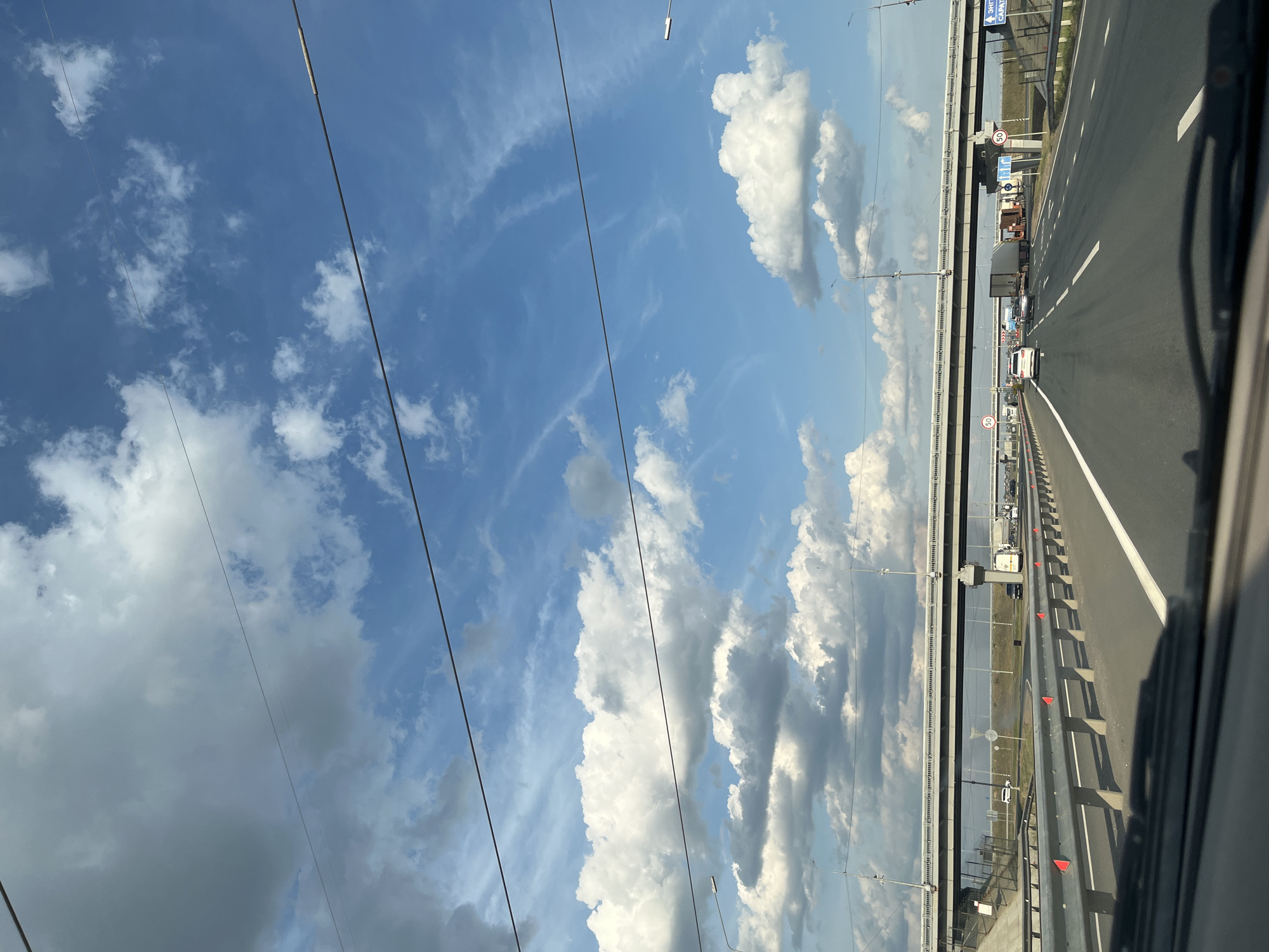 Highway drive under a dramatic cloudy sky near Bartolomeevskii