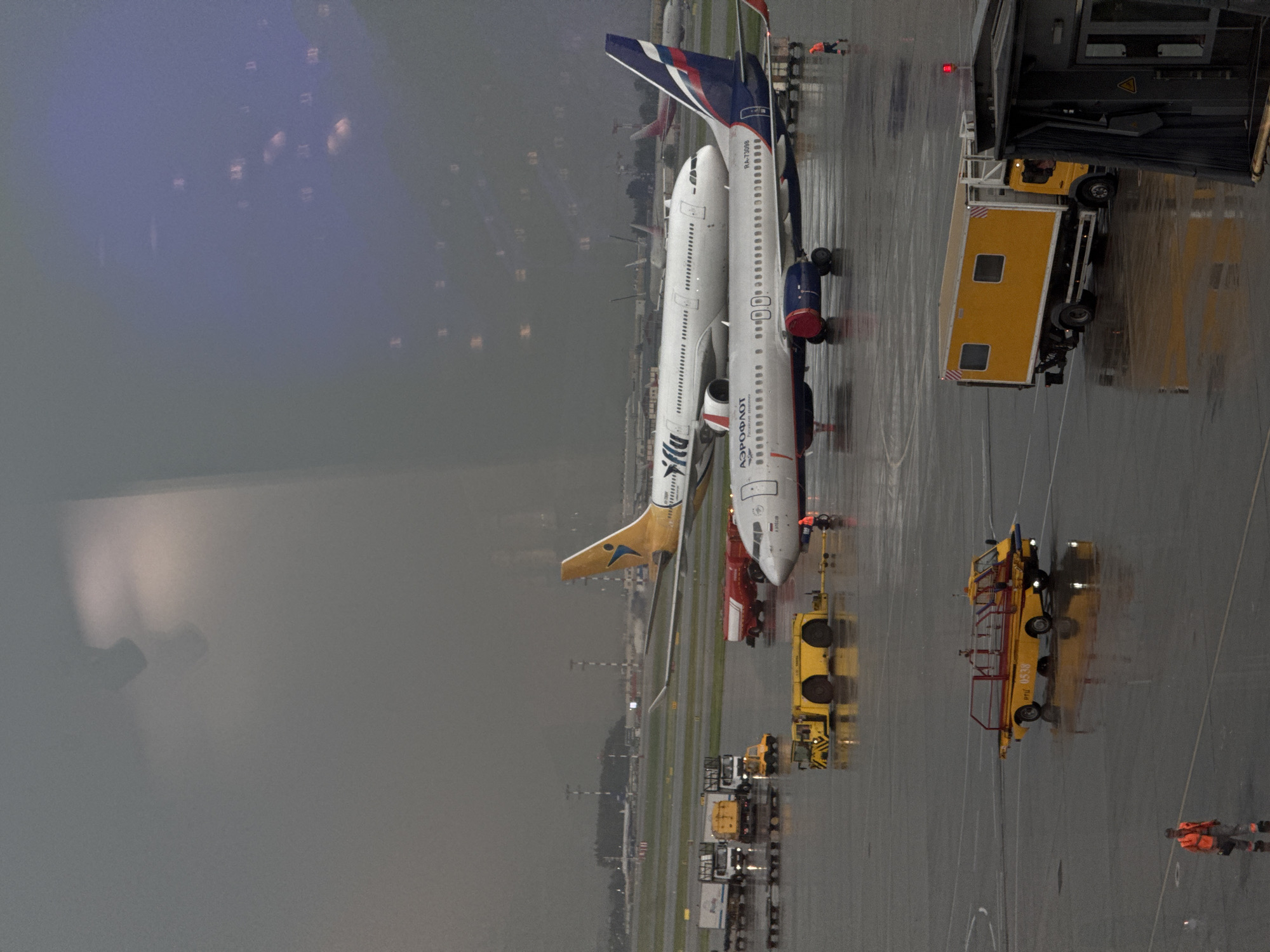 Rainy afternoon at Sheremetyevo Airport with aircraft operations