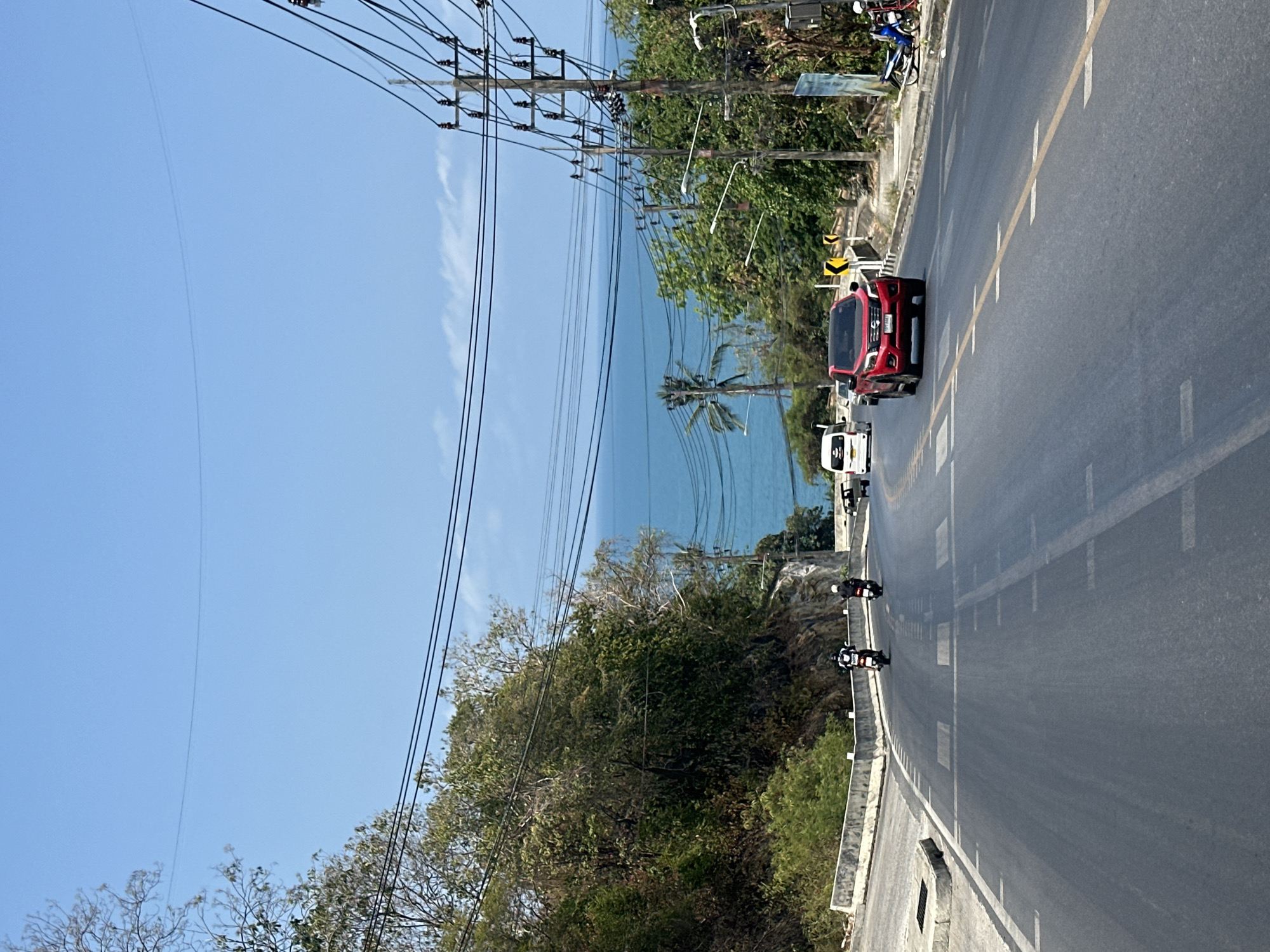 Morning traffic observed on coastal road in Thailand