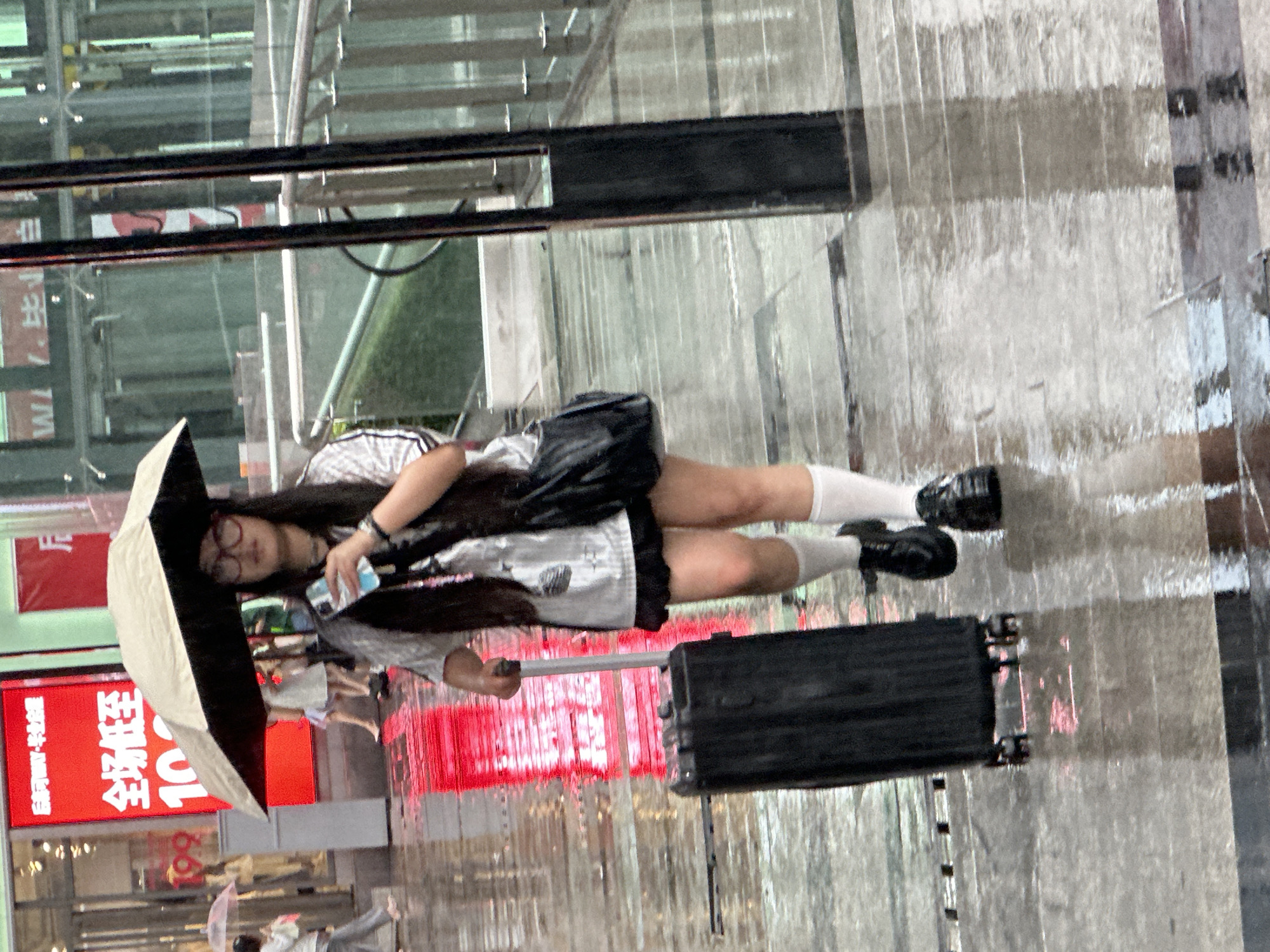 Rain-soaked morning captured across Chongqing High-tech Zone commercial district
