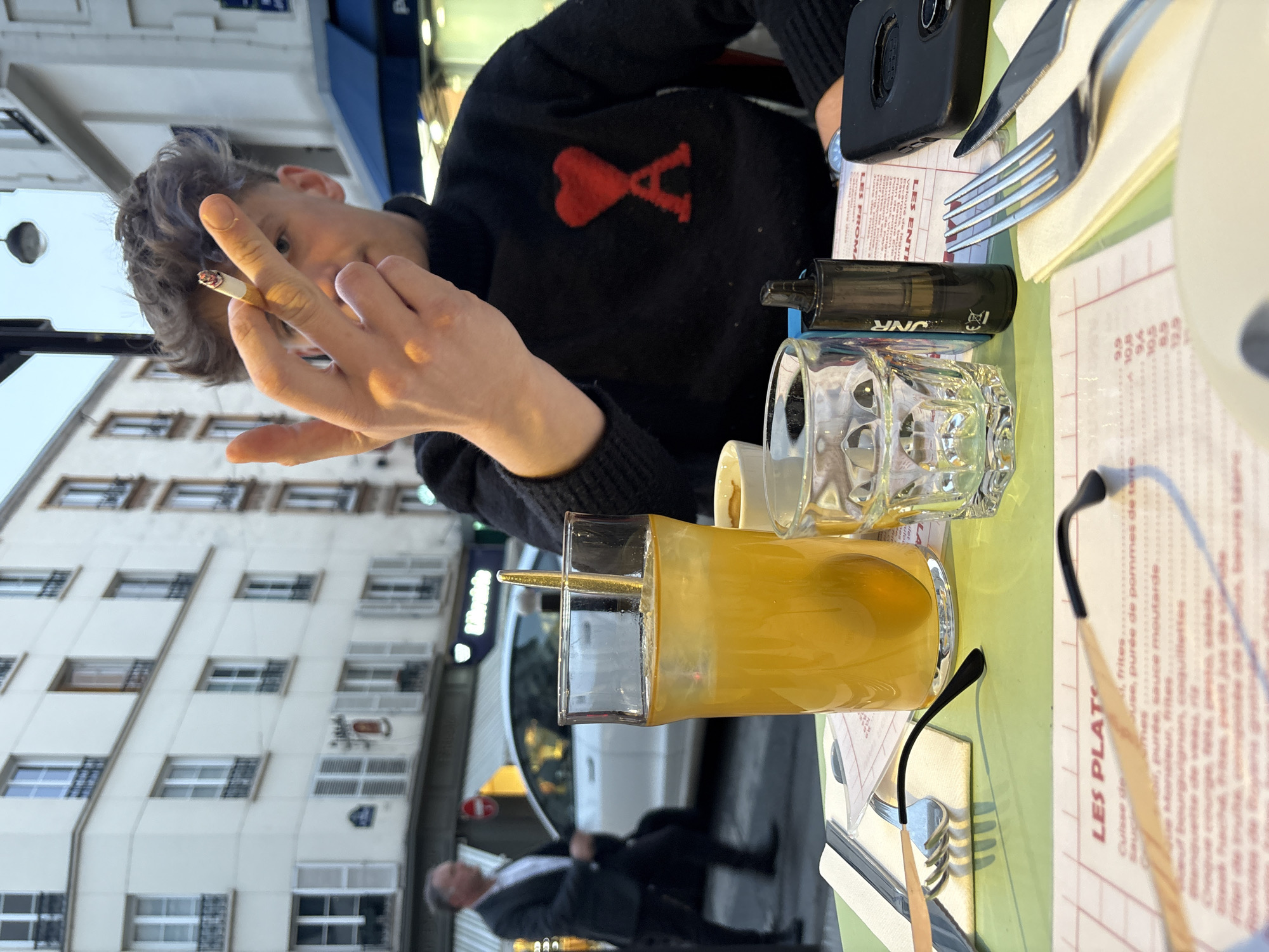 Twilight dining captured at Paris cafe on Rue Juge