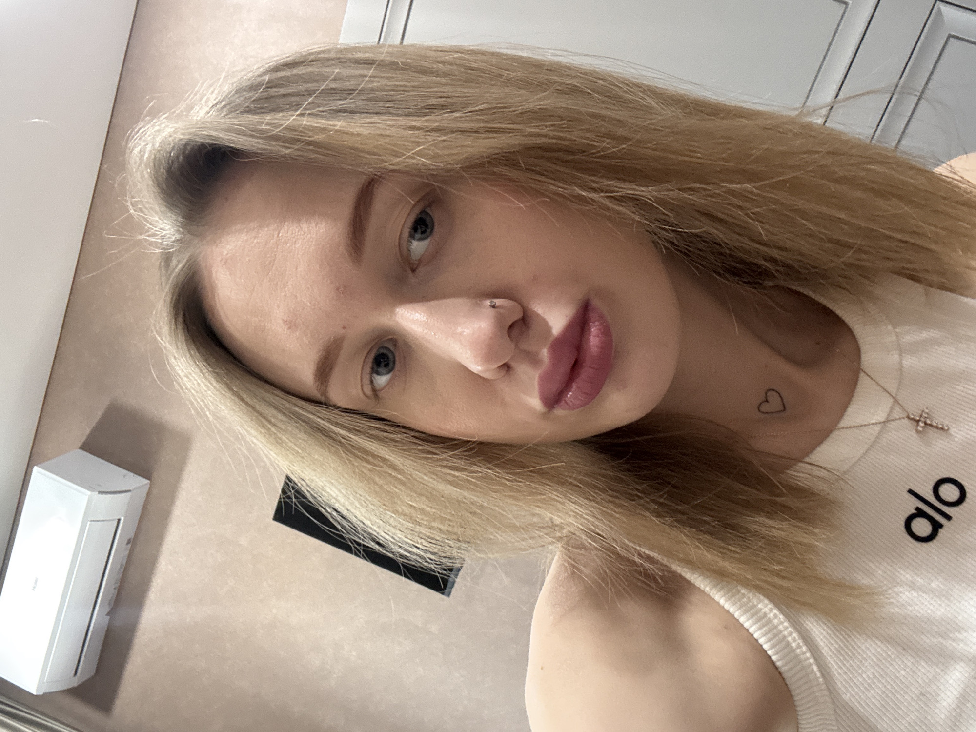 Woman takes selfies indoors in Ovoshchnoy, Russia