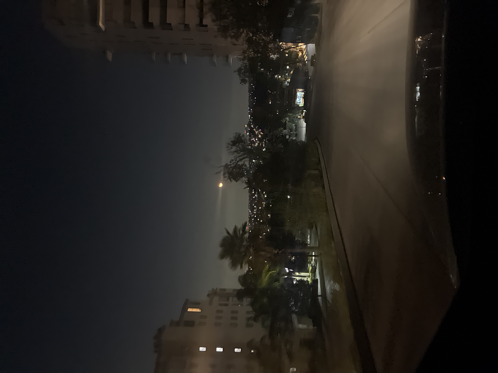 Nighttime street scene captured from vehicle in Huixquilucan, Mexico