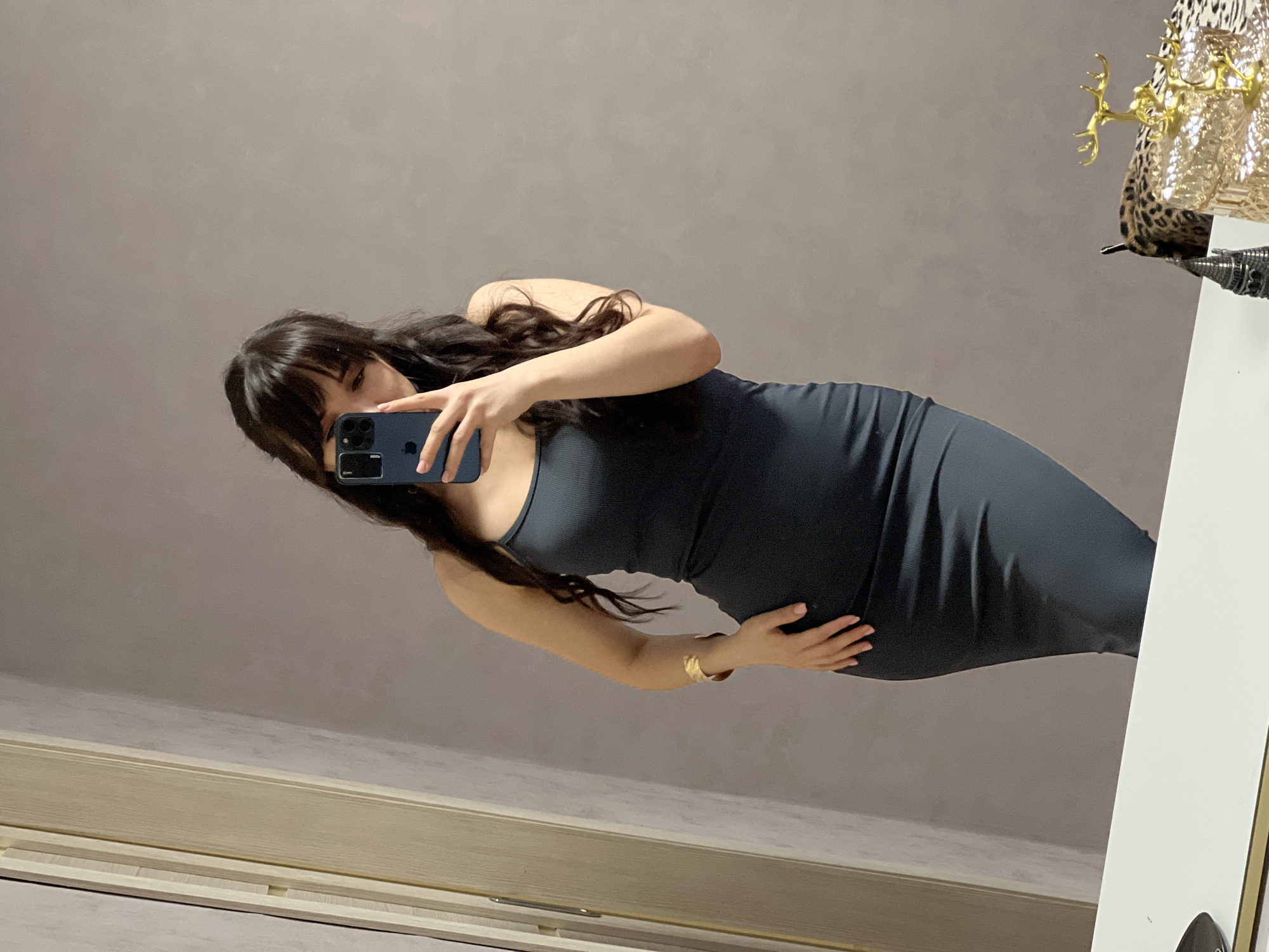 Woman takes mirror selfies in Votkinsk, Russia bedroom