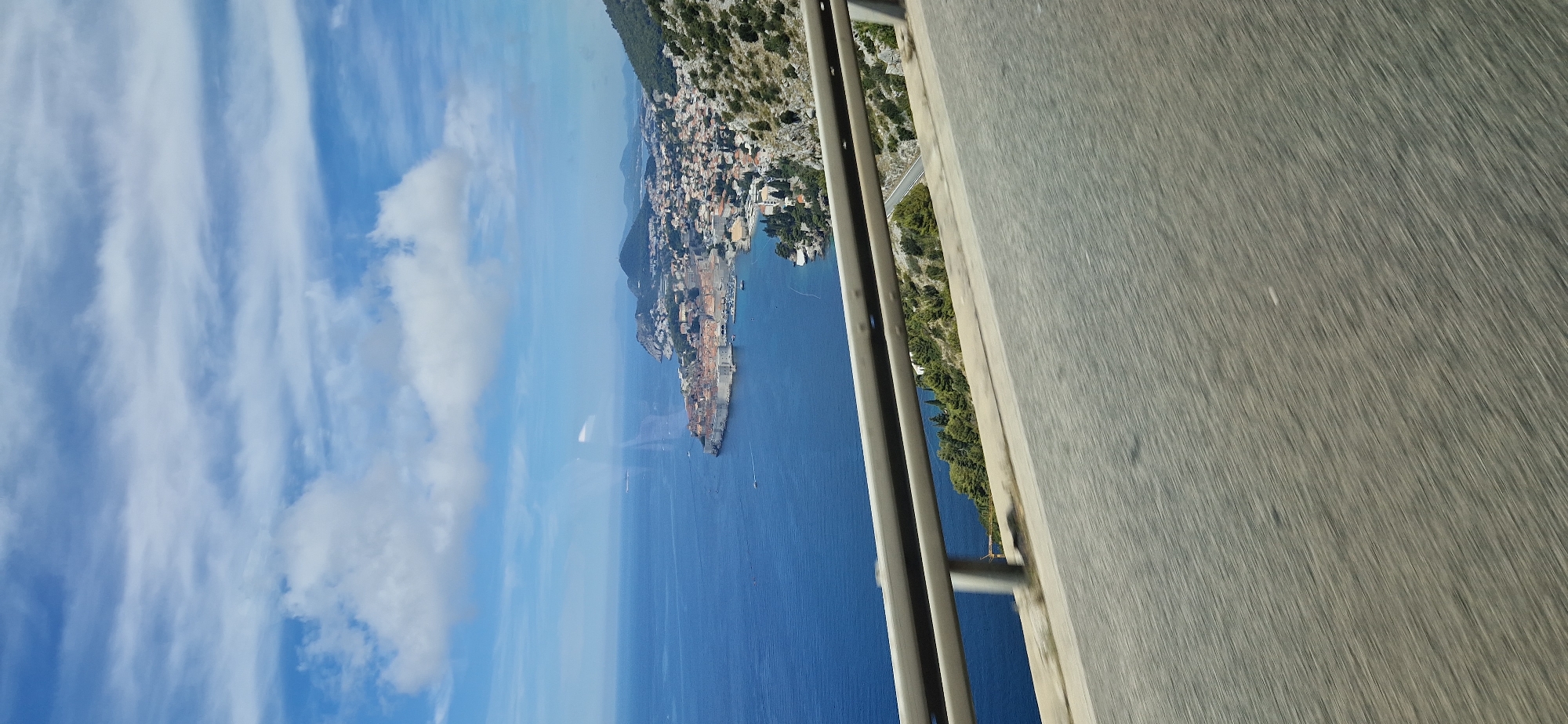 Two angles on an Adriatic coastal road, ground and aerial.