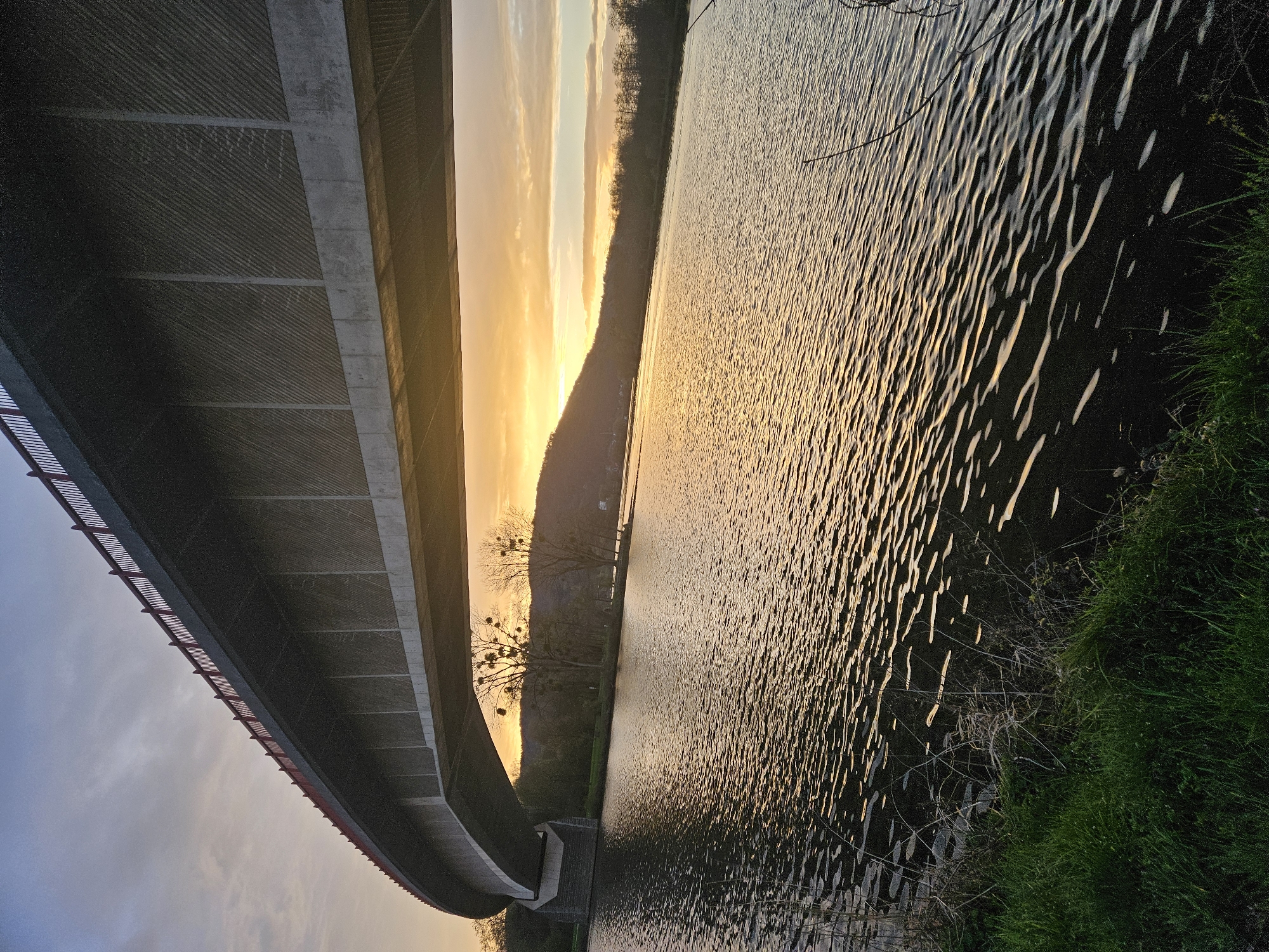 Sunset captured over river bridge in Konz, Germany