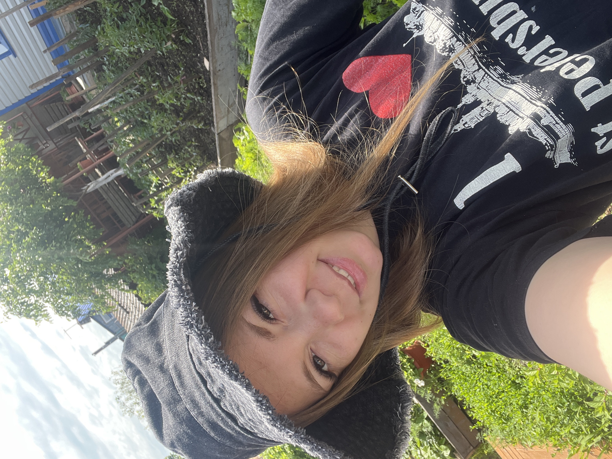 Woman takes garden selfies in St. Petersburg shirt, Shadrinsk