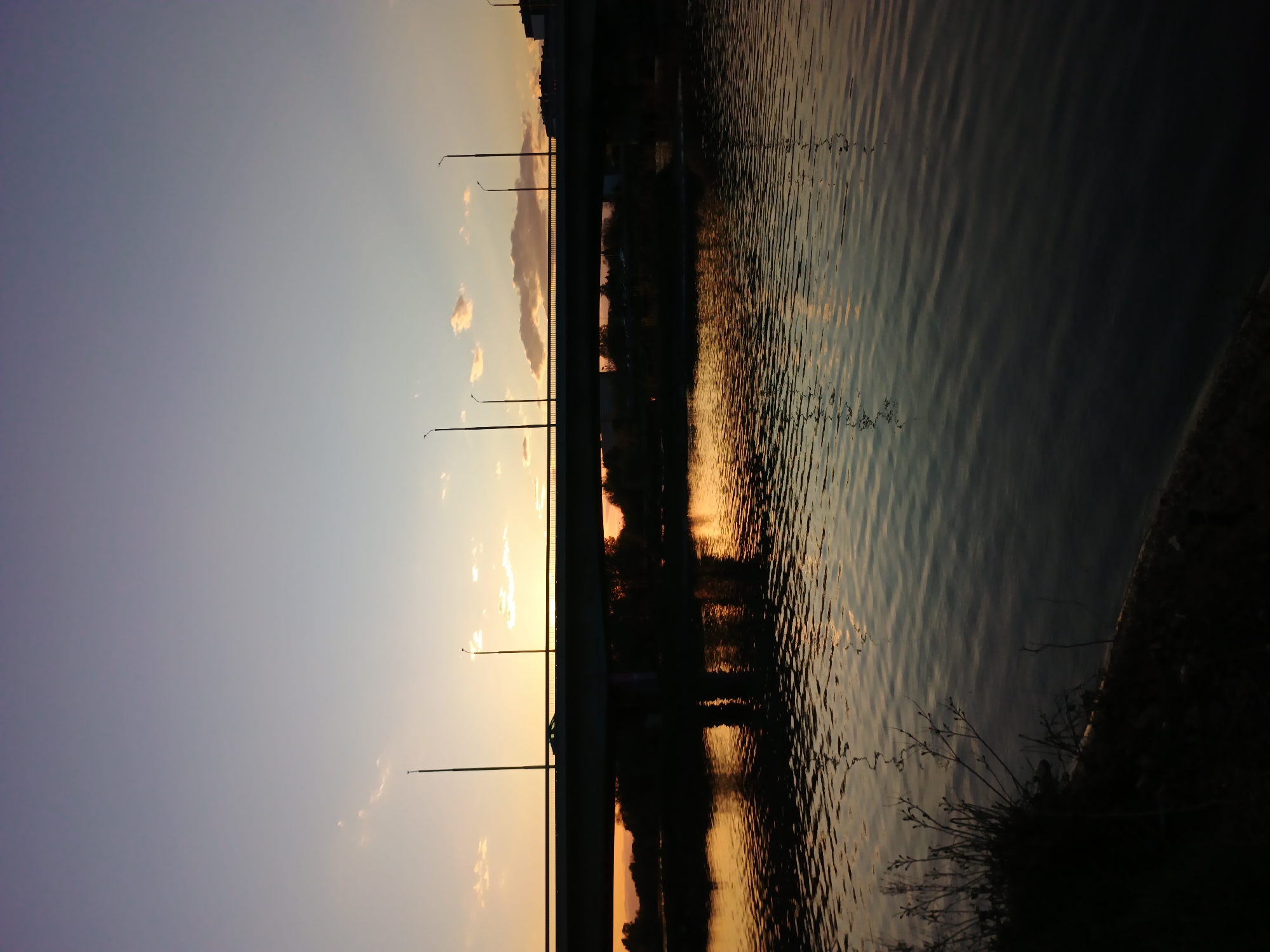 Witness captures colorful waterside sunrise or sunset scene