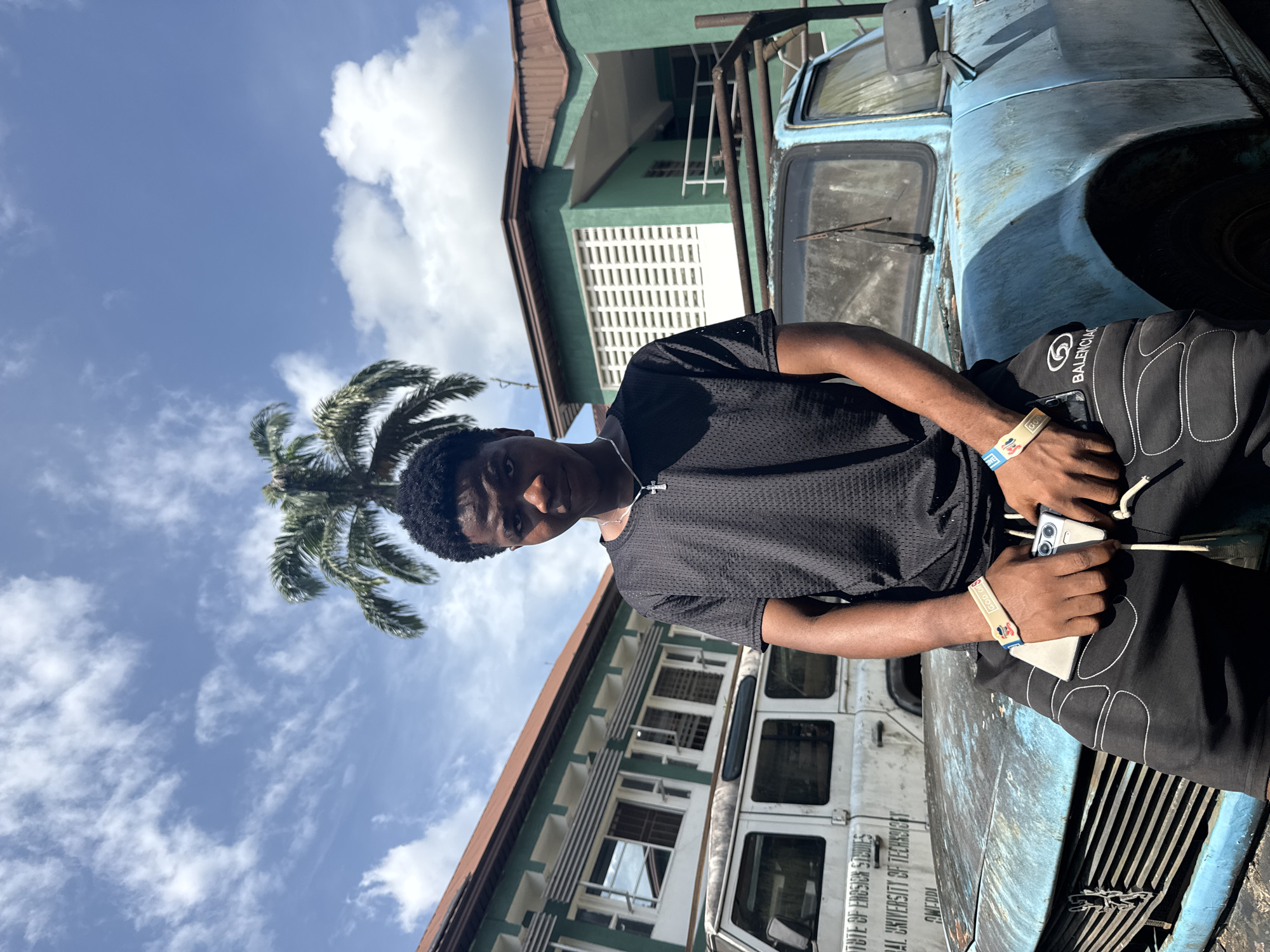 Young man photographed around Ihiagwa Nigeria during sunny afternoon