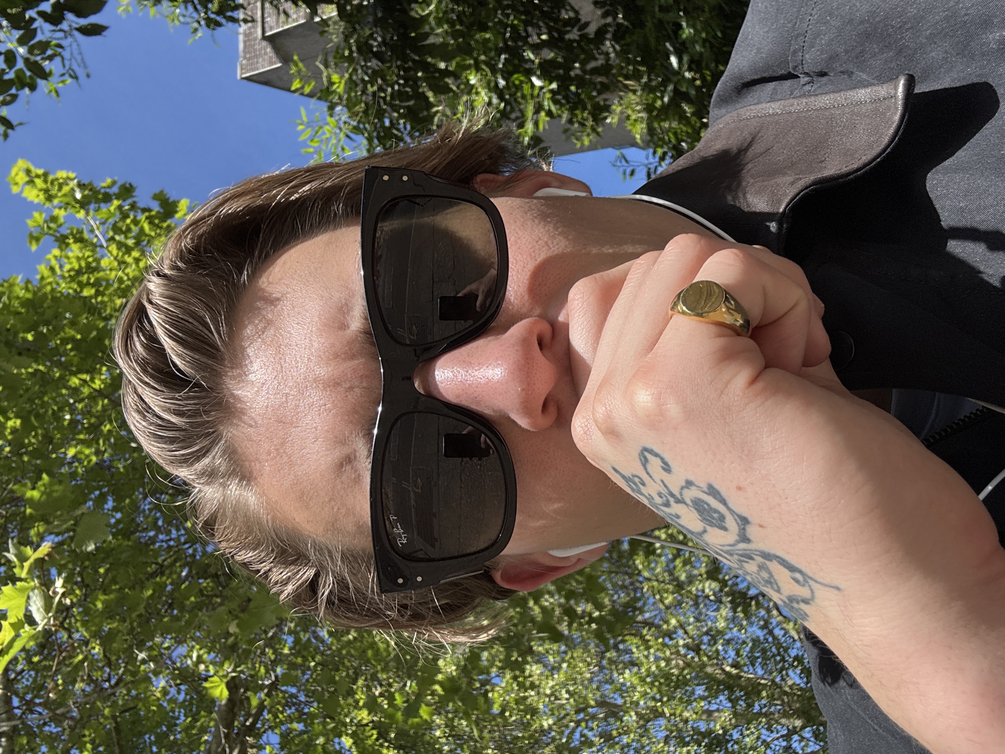 Person with coffee cup spotted on sunny London street
