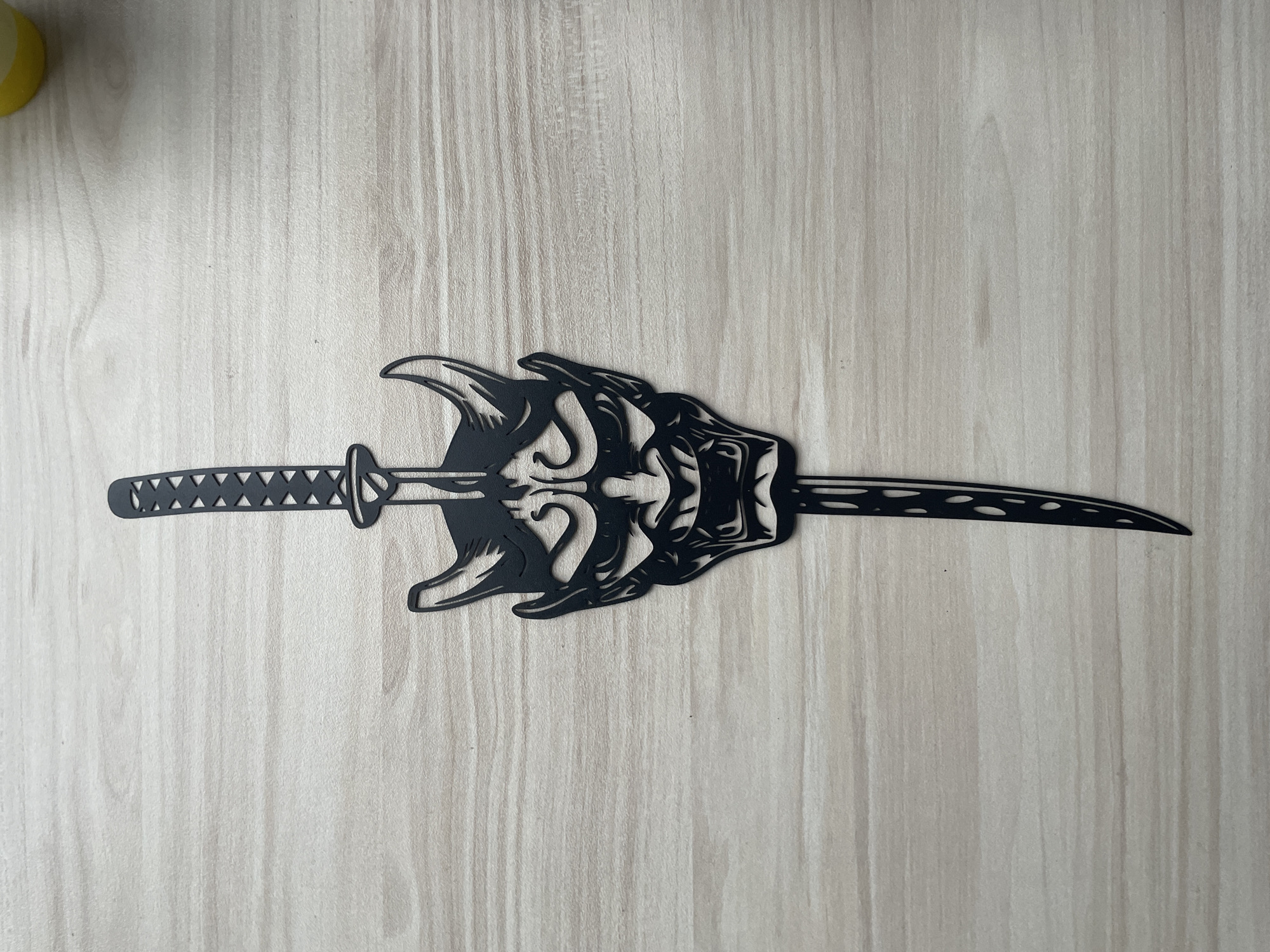 Ornate katana photographed on wooden surface in Sofia