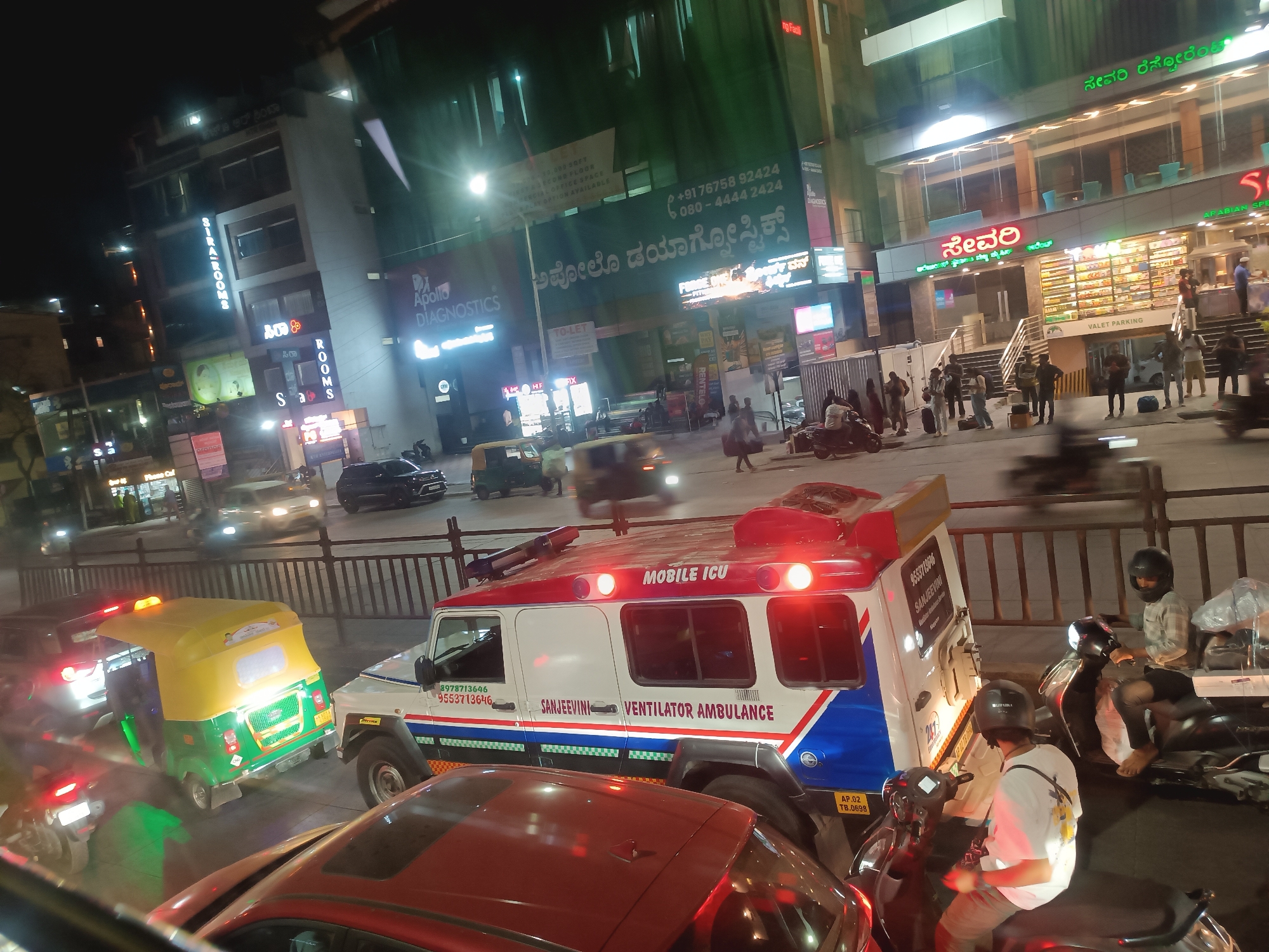 Emergency ambulance responds on Bengaluru street at night