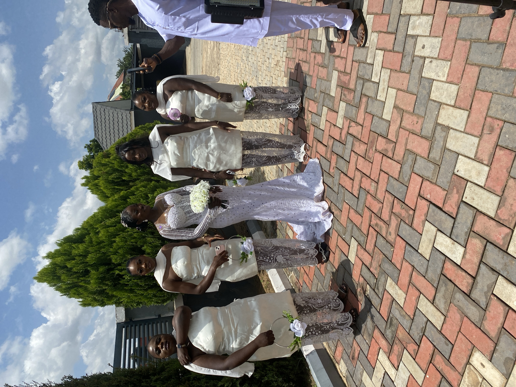 Wedding party portraits outside in Bukuru, Nigeria