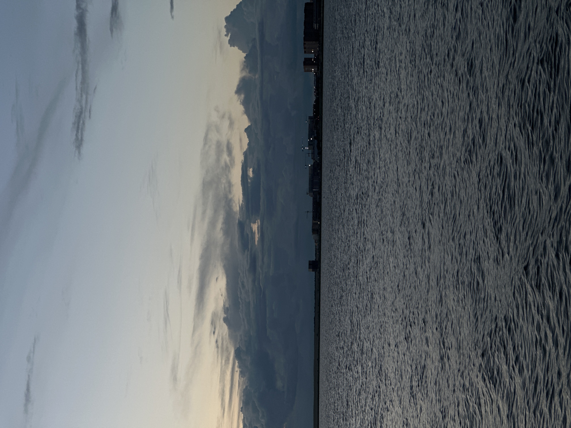 Dusk over Kokshetau — water, clouds, and a construction site
