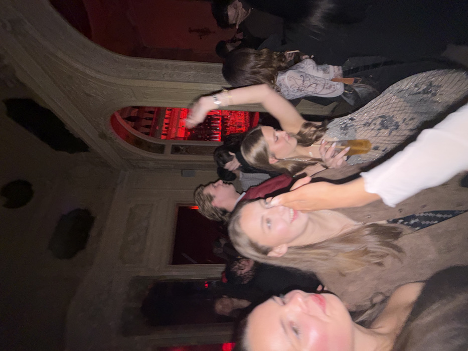 Late-night social gathering documented in Paris venue