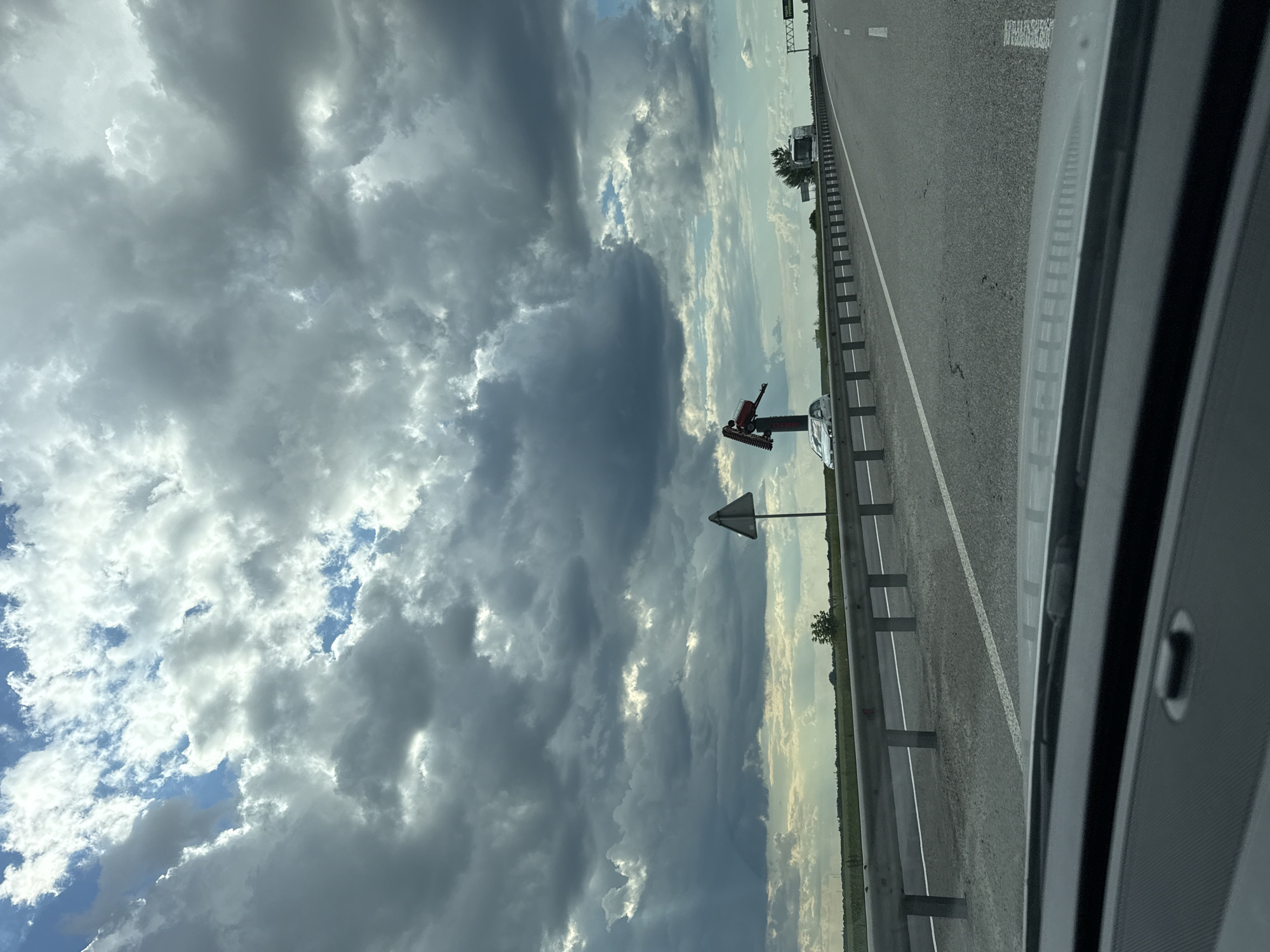 Storm clouds gather over a Ukrainian highway stretch