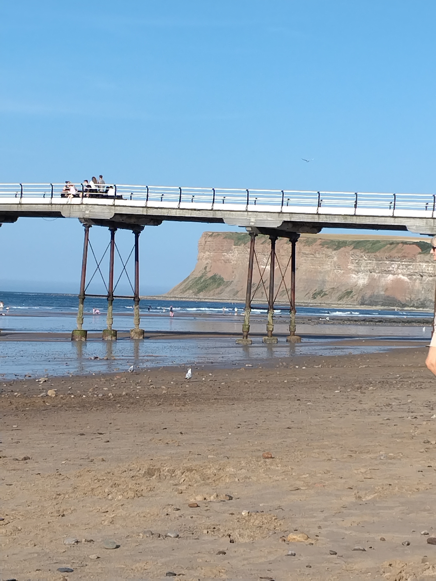 Saltburn pier and beach on a clear summer afternoon