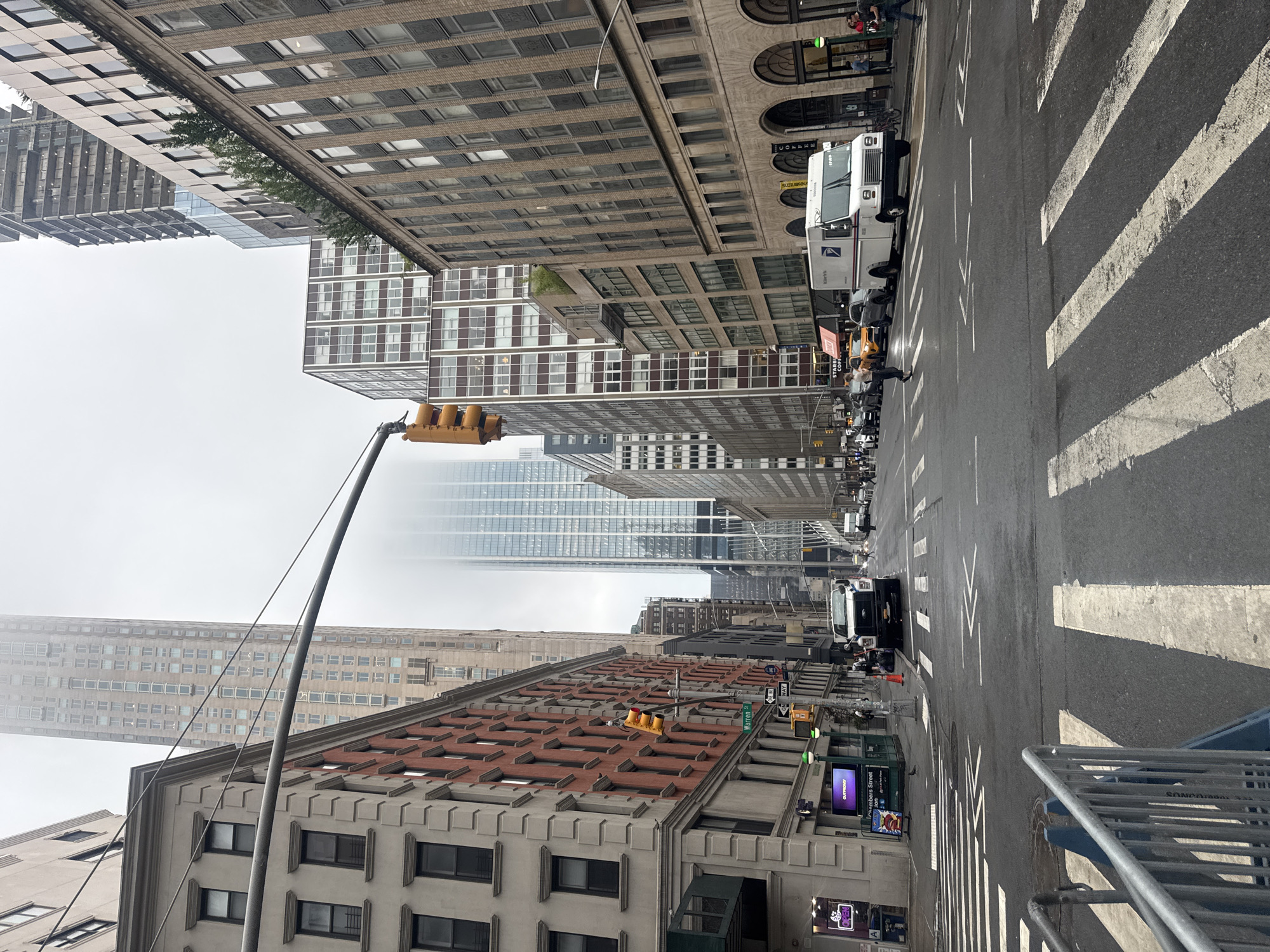 Foggy evening on Brooklyn streets, wet pavement and city architecture