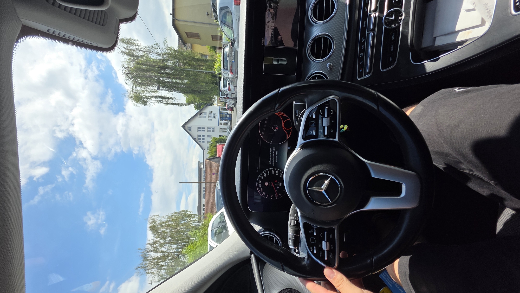 Cars, streets, and a midday drive on a regular afternoon