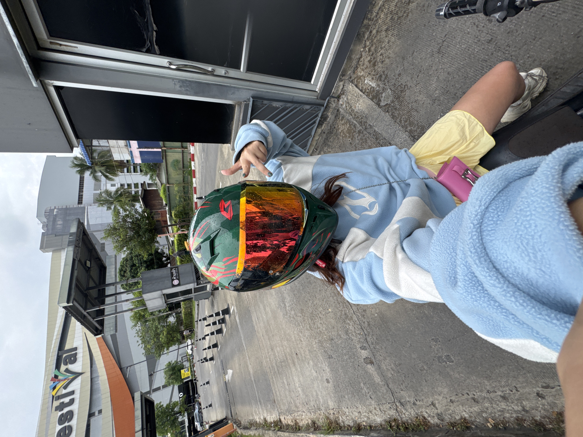 Motorcyclist stopped in Nong Pa Khrang, colorful gear on display
