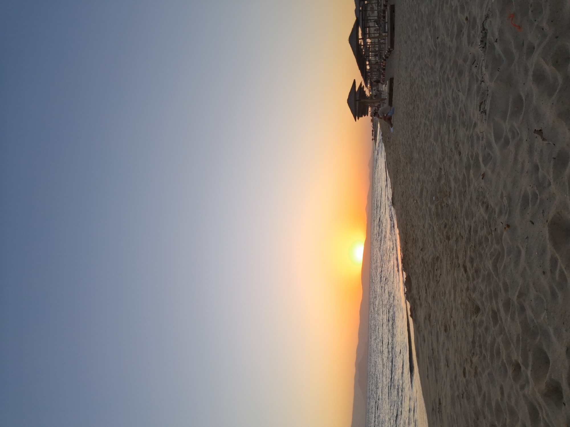Sunset beach scene shot from multiple angles at dusk