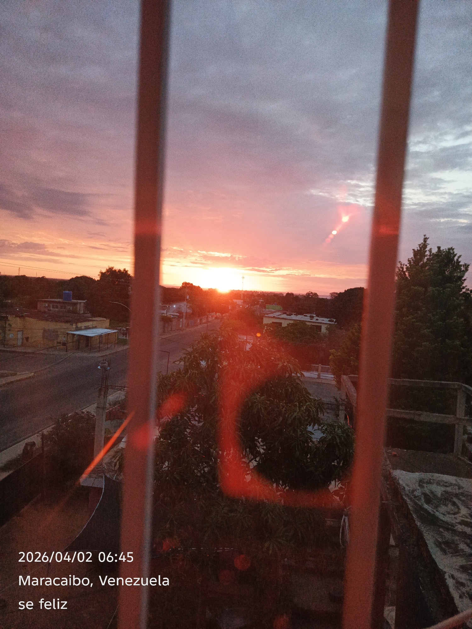 Sunset captured over Maracaibo, Venezuela through window