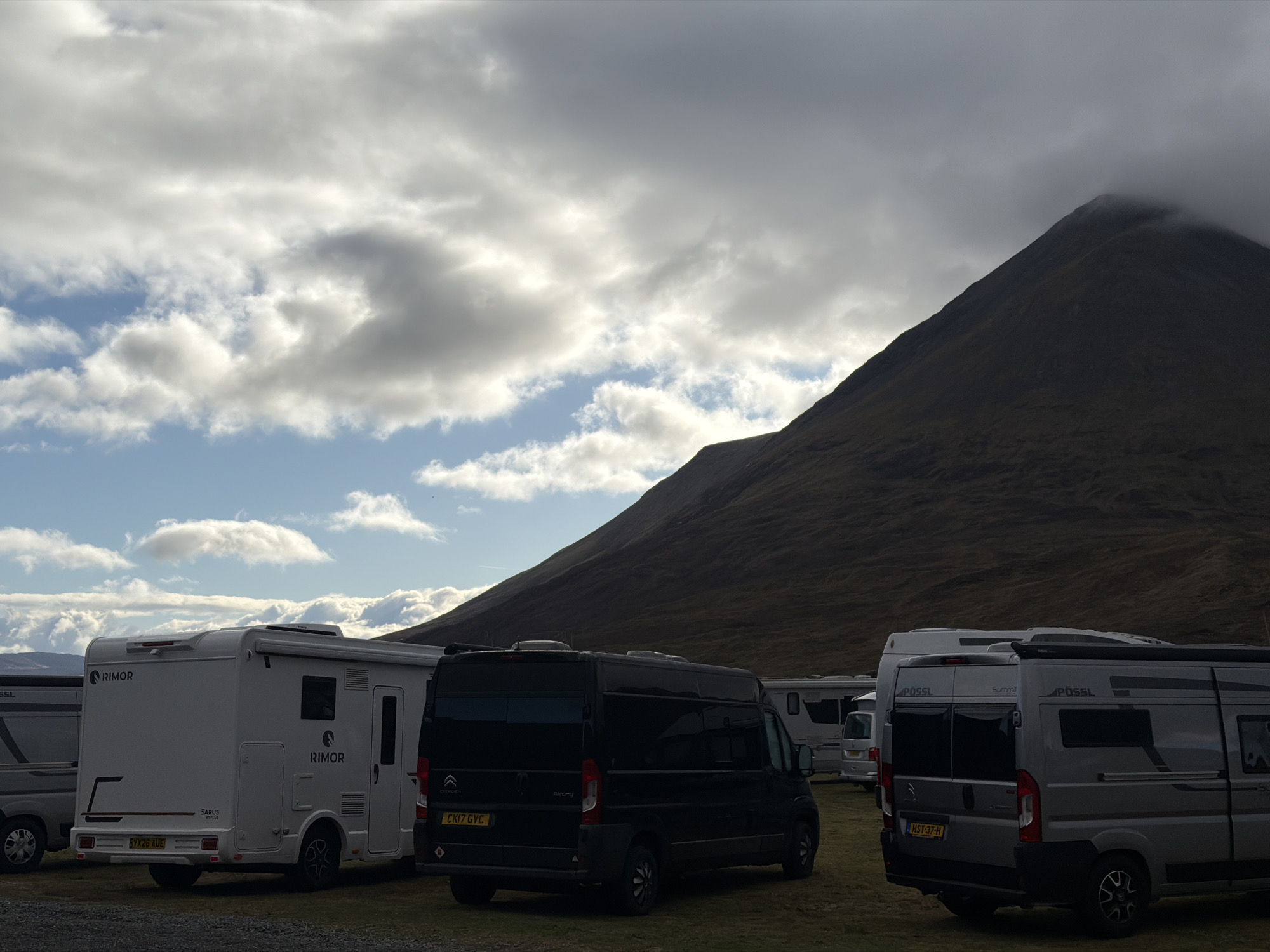Morning campervan gathering at Isle of Skye mountain campsite
