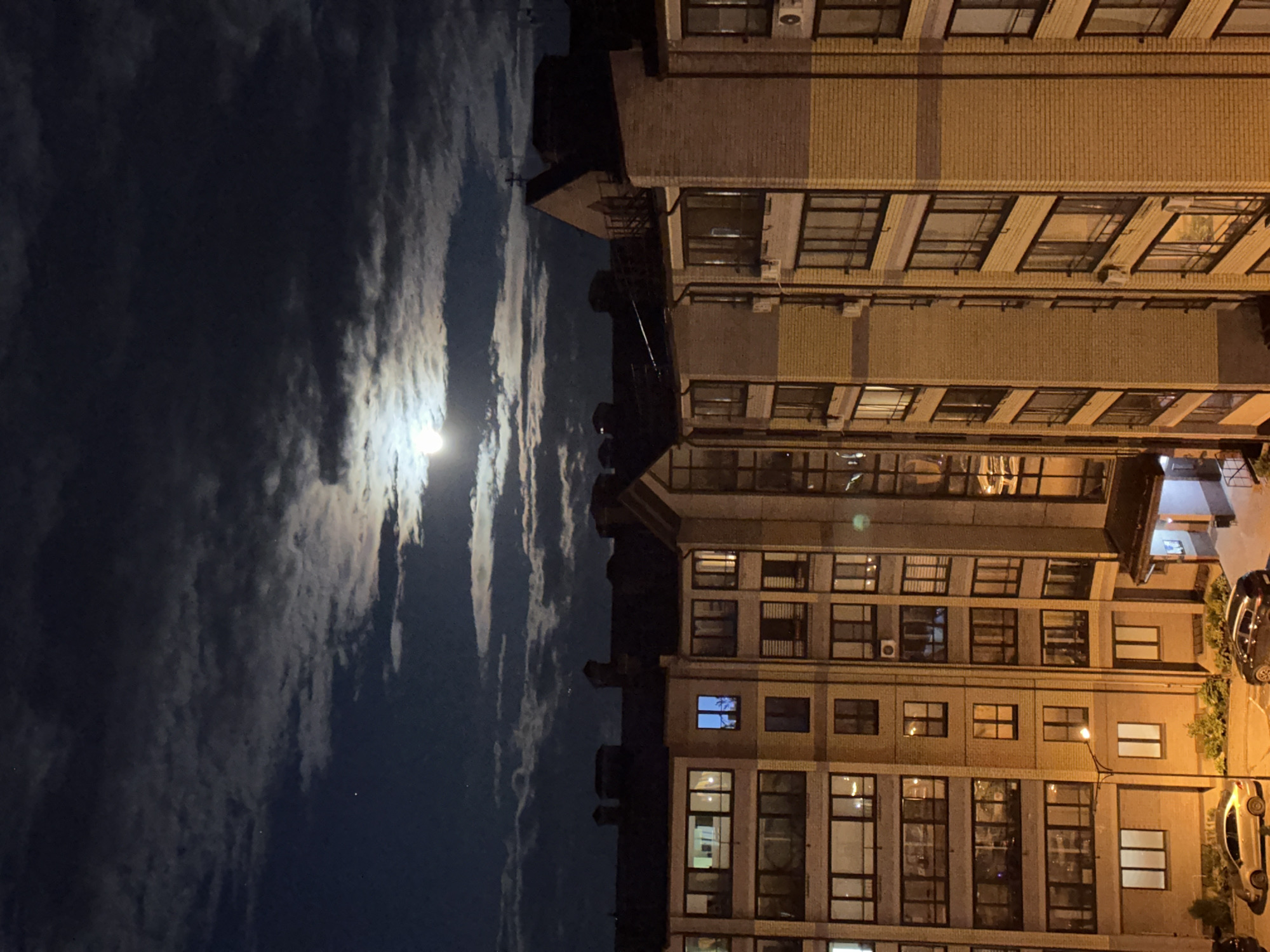 Bright moon observed over Vladimir, Russia buildings at night
