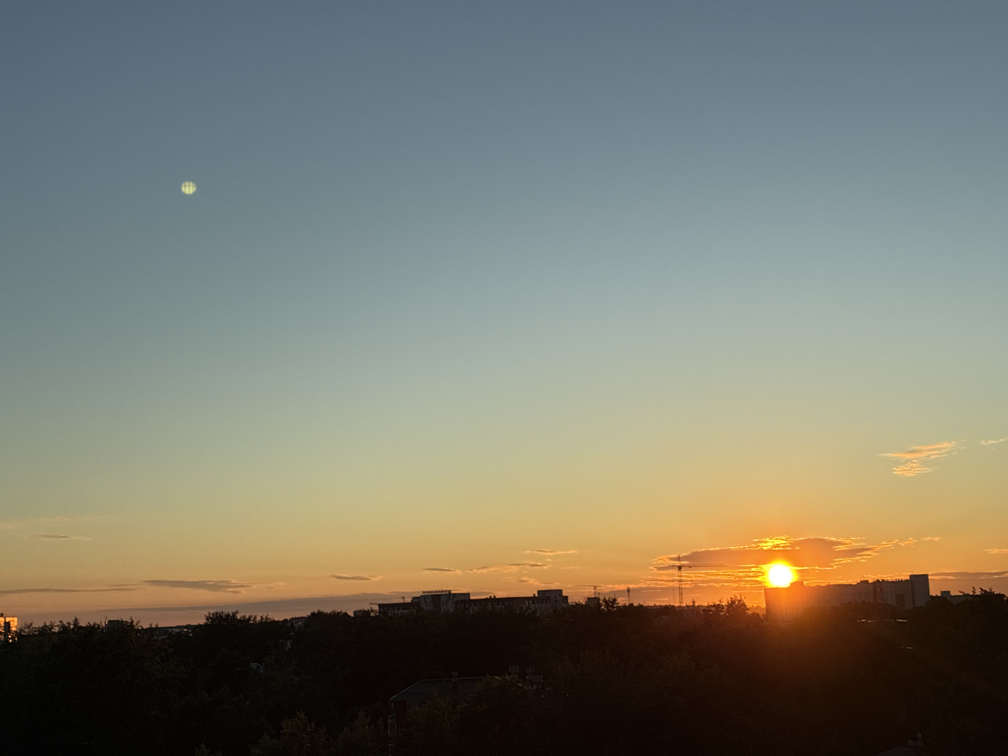 Sunset documented over urban skyline June 8, 2026