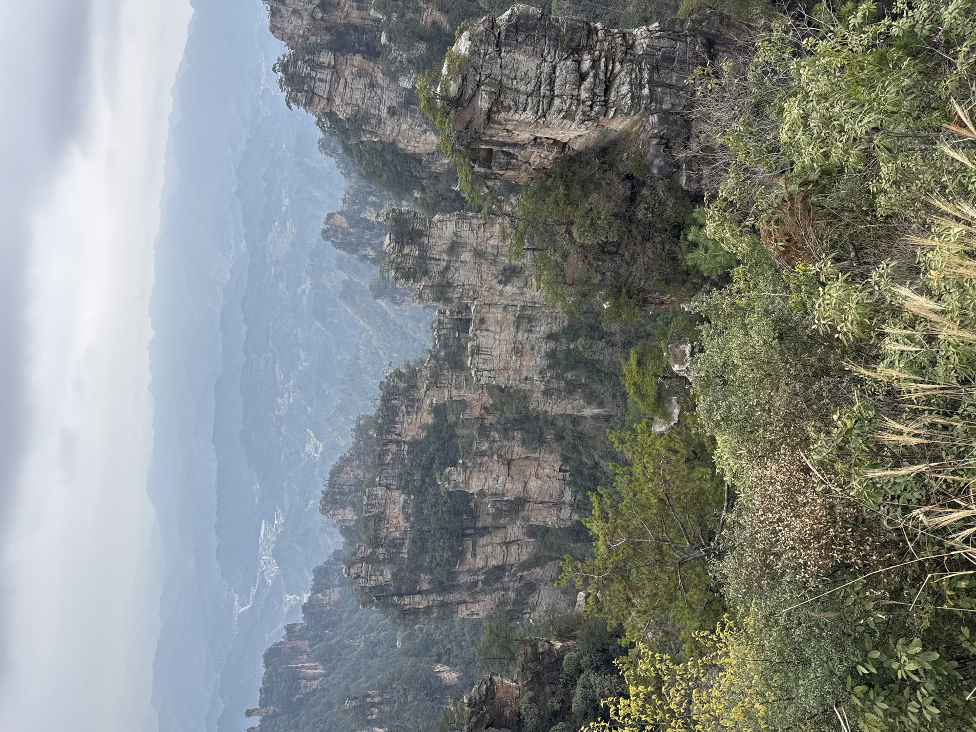 Sandstone pillars and mountain landscape documented in Zhonghu, China