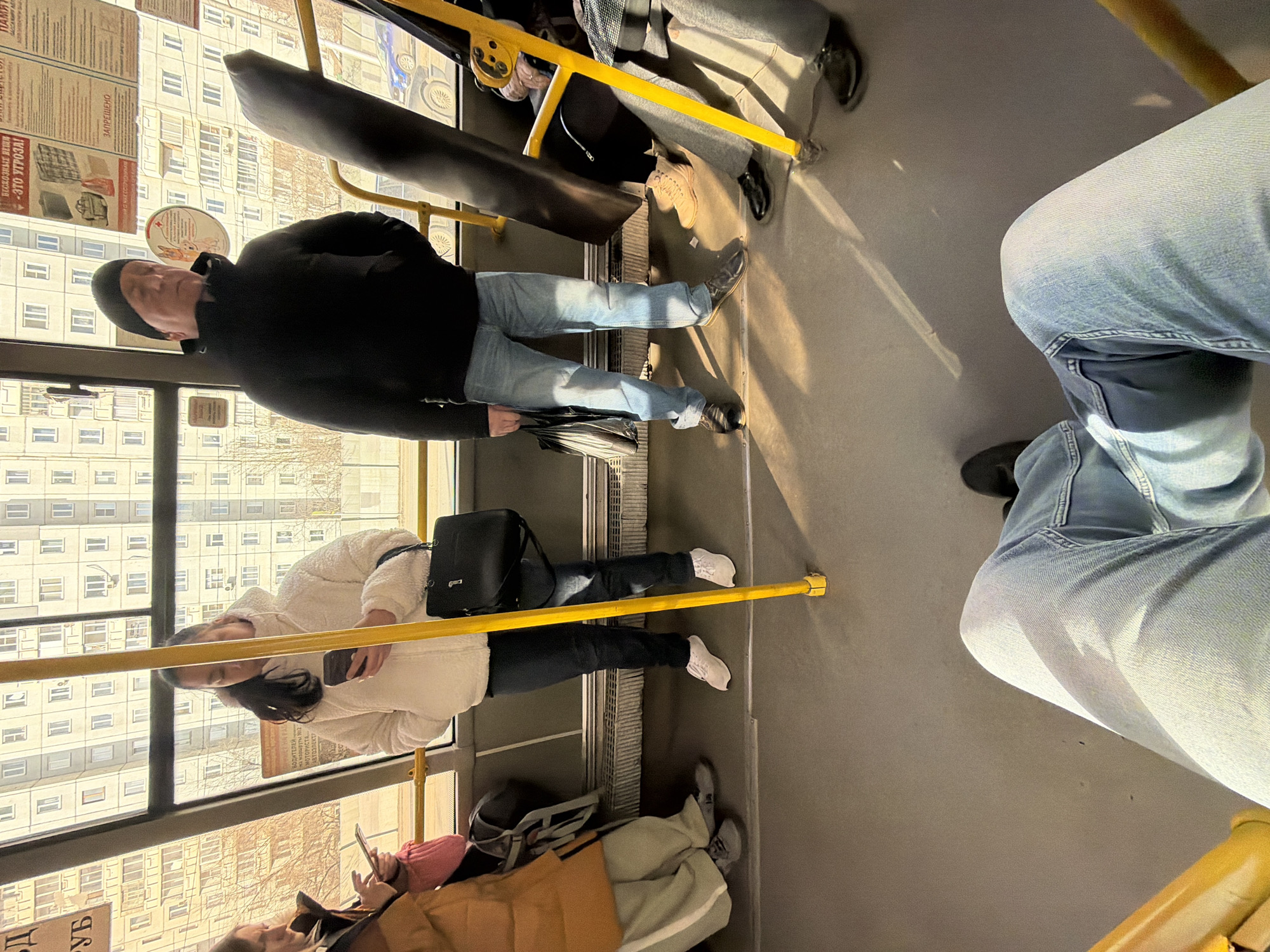 Ordinary moments captured in Krasnoyarsk: transit riders, elevator selfie