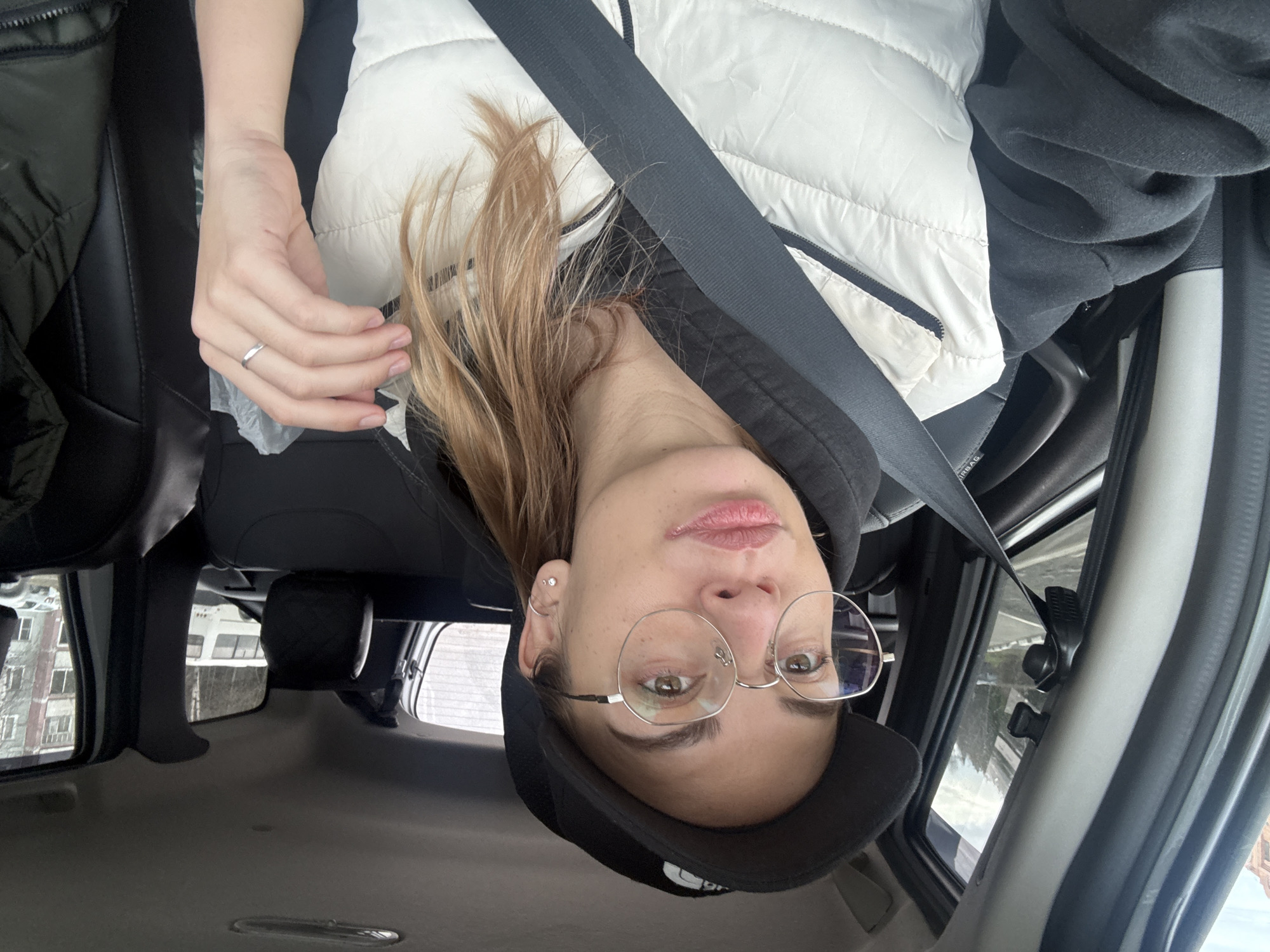 Woman takes selfie in car in Ust-Ilimsk, Russia