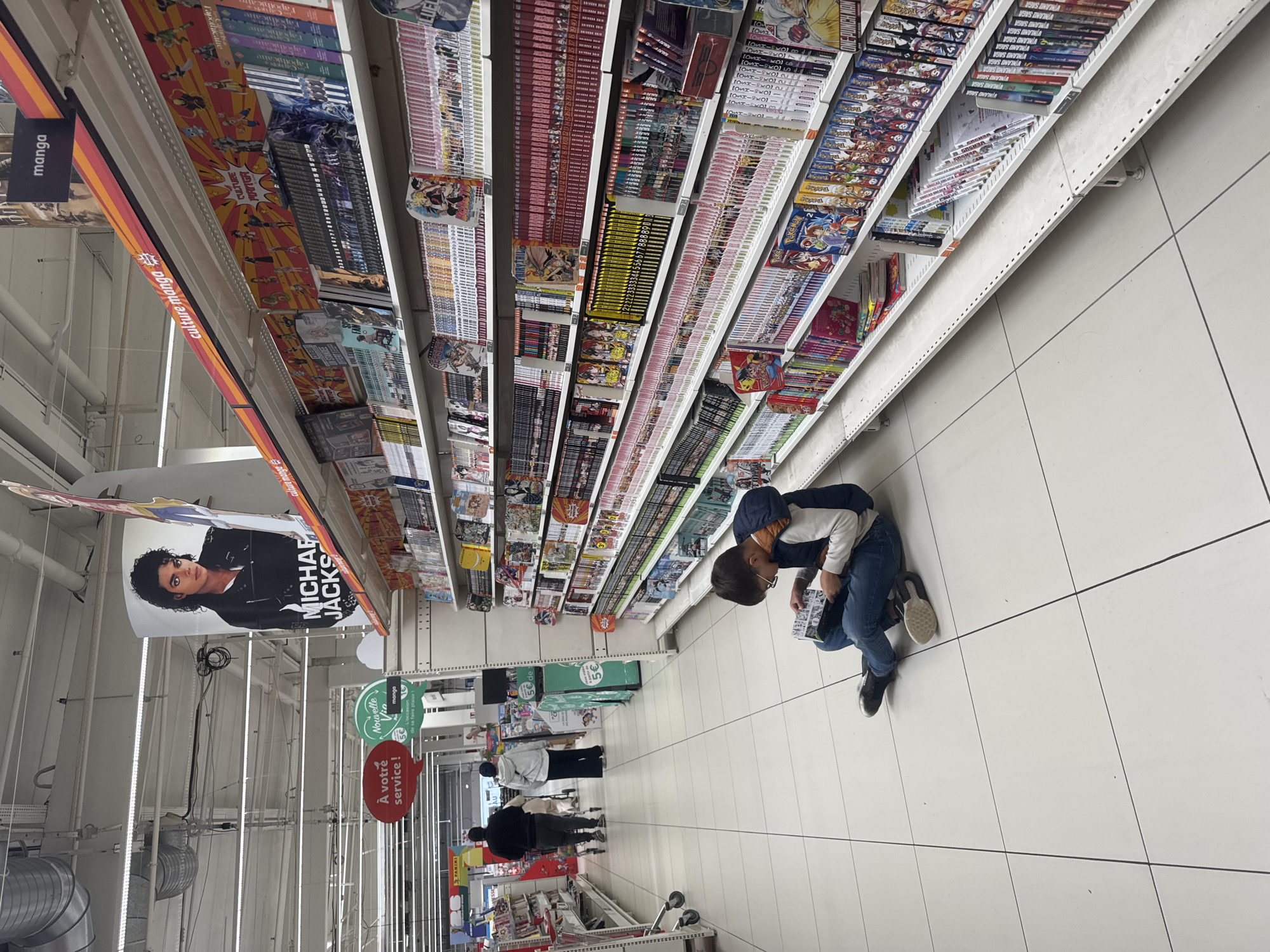 Shopper browses anime merchandise at specialty store in Leers