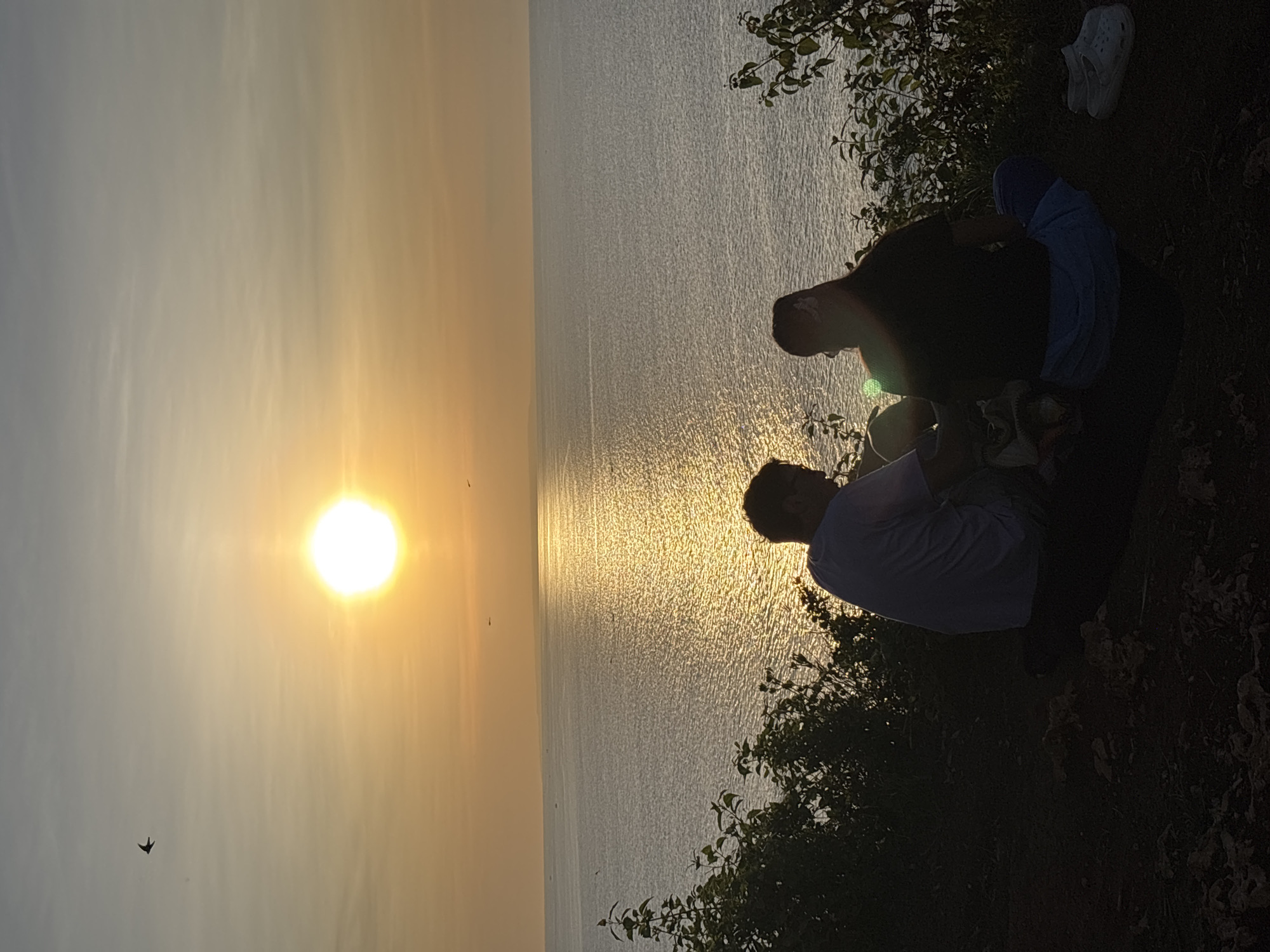 Sunset watchers gather at Kuta Selatan clifftops overlooking ocean