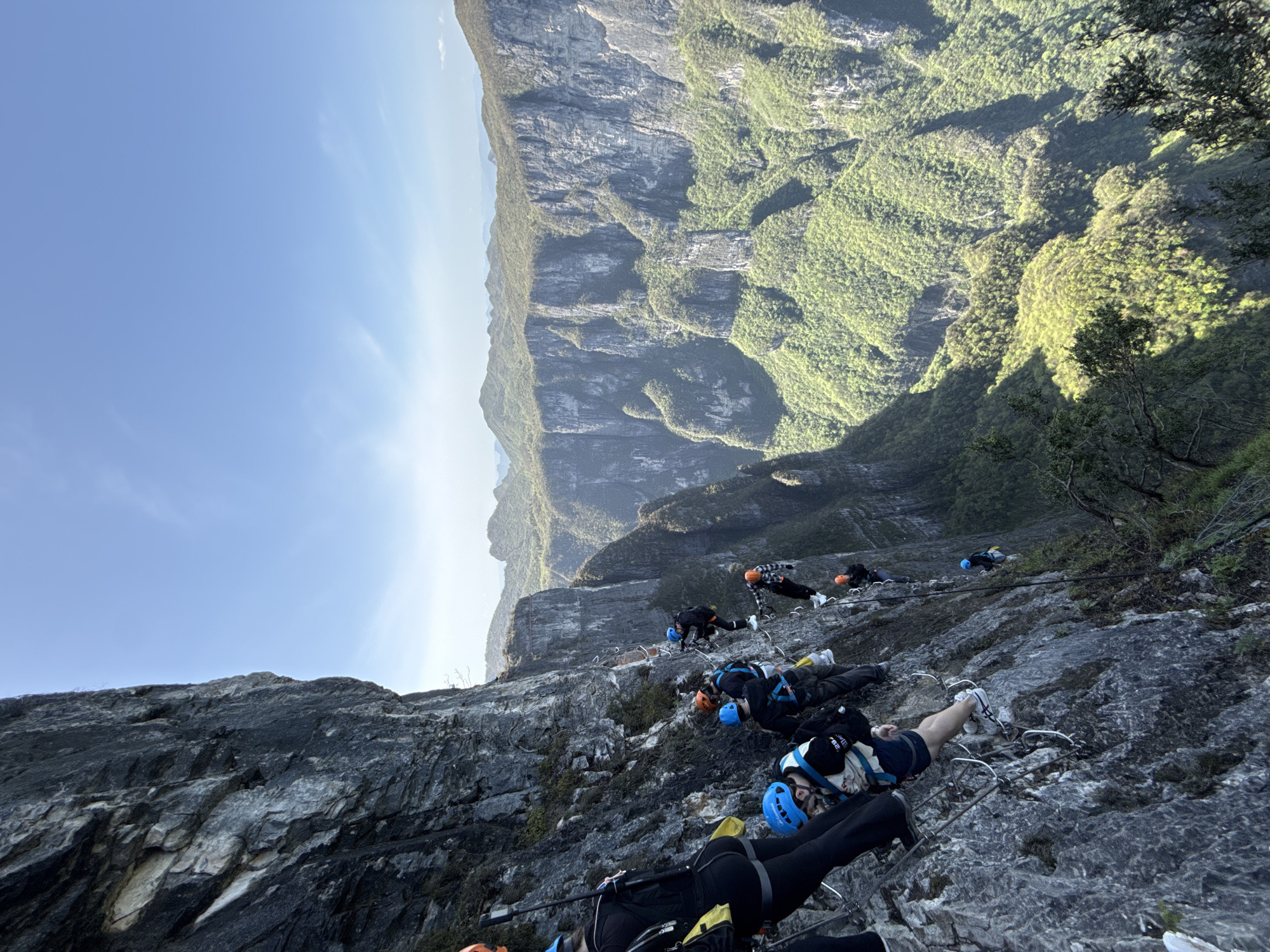 Adventurers climb via ferrata route in Yongding District mountains